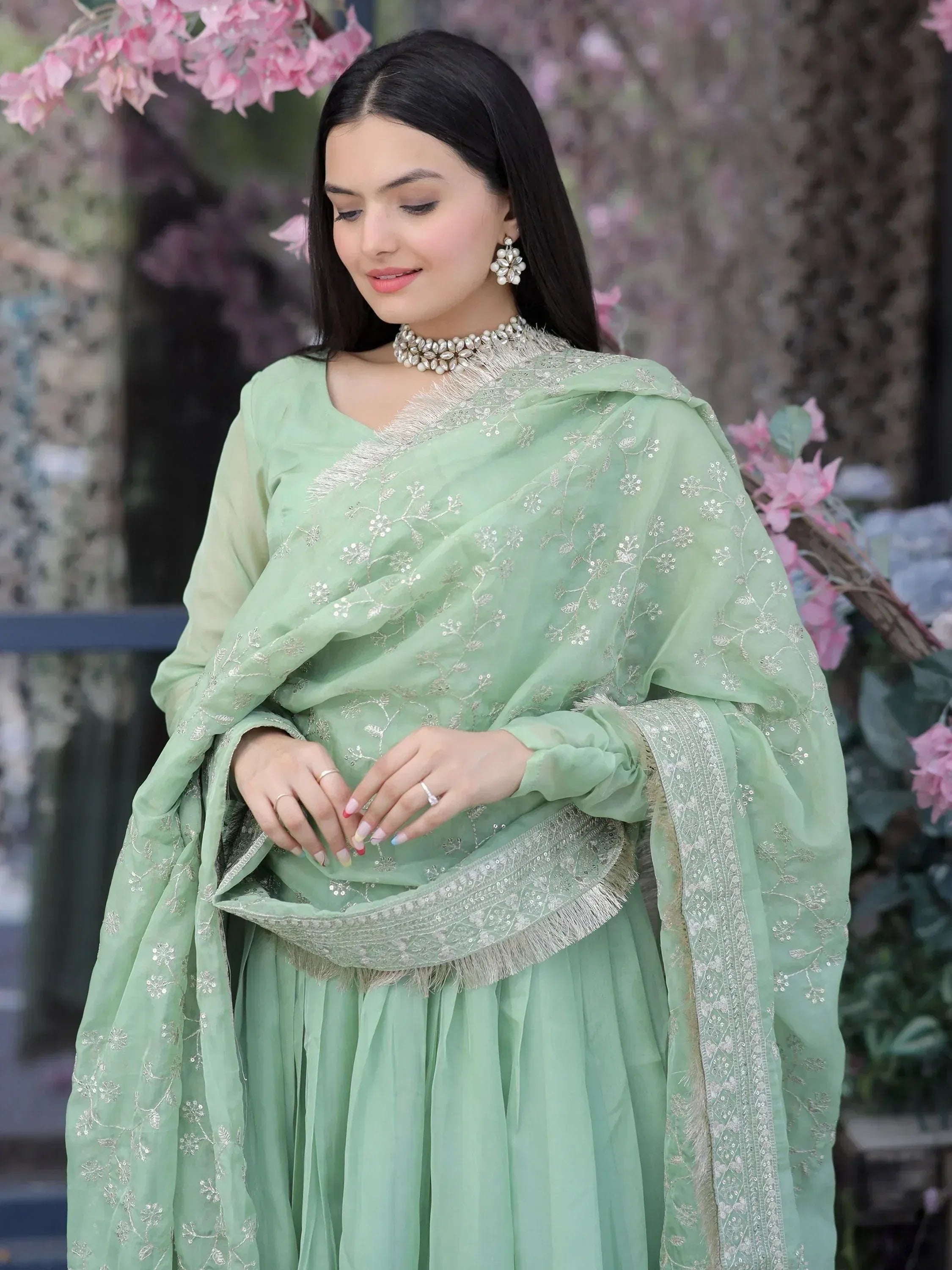 Mint green embroidered salwar kameez with floral detailing, perfect for ethnic occasions