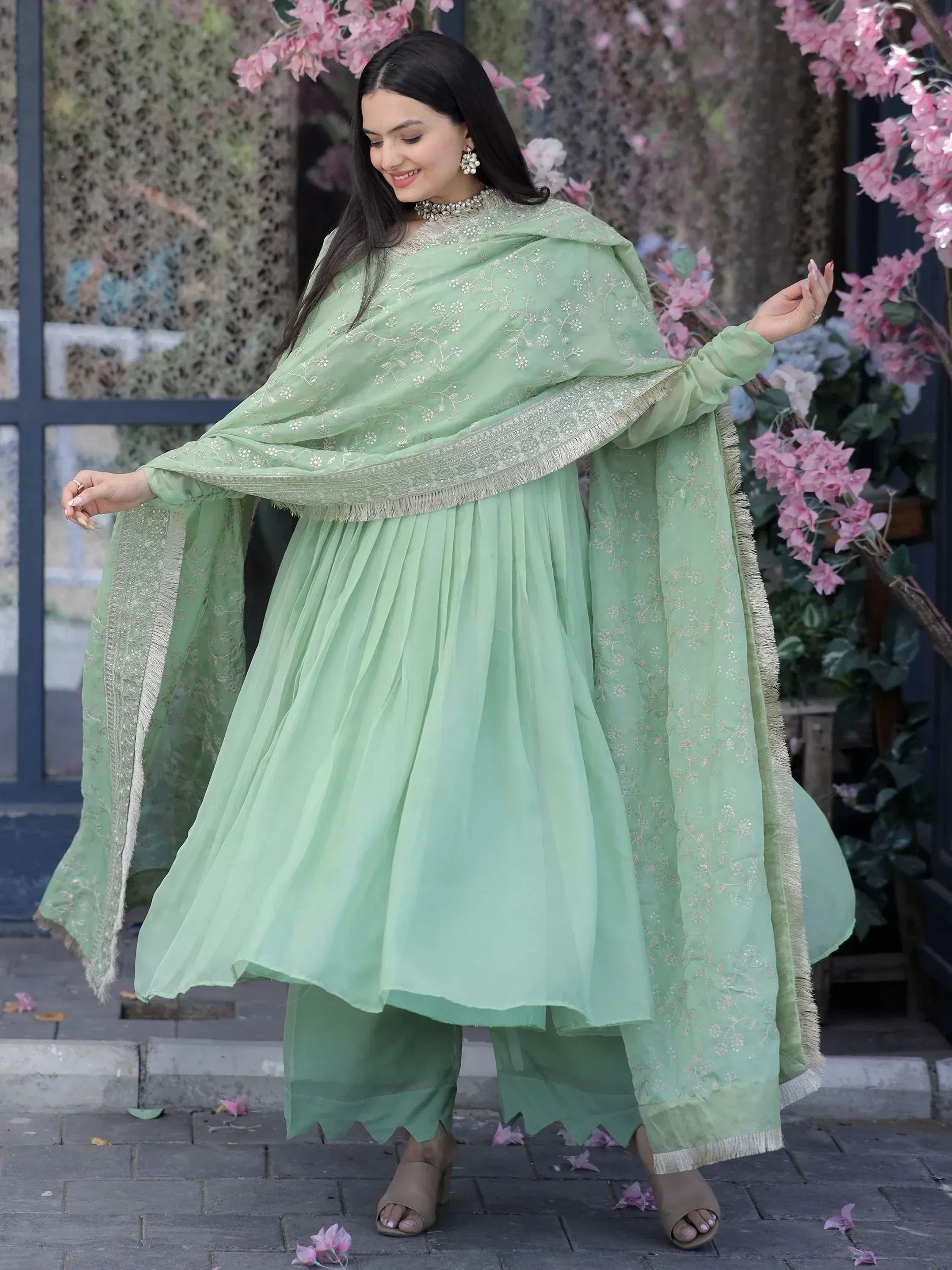 Mint green embroidered salwar kameez with pleated skirt and dupatta, perfect for Indian ethnic occasions