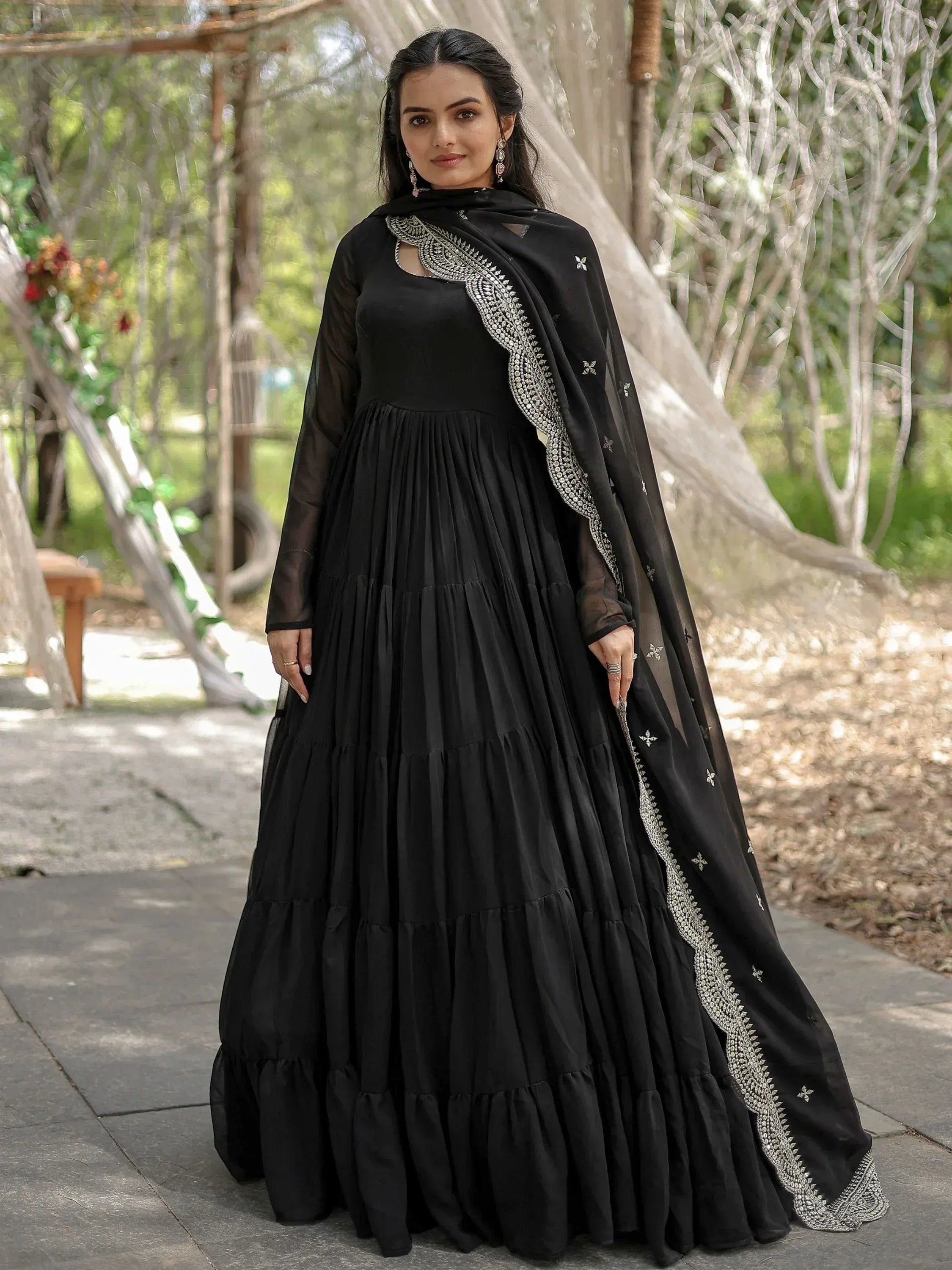 Black ethnic gown with silver embroidery and sheer dupatta, perfect for Indian occasions