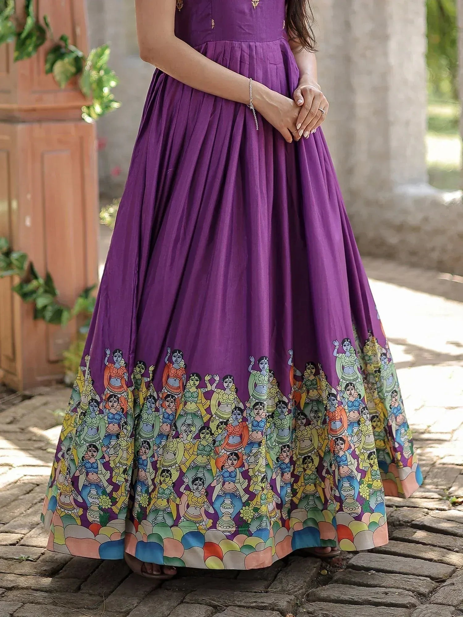 Purple ethnic gown with colorful folk art print, perfect for Indian celebrations and festive occasions.