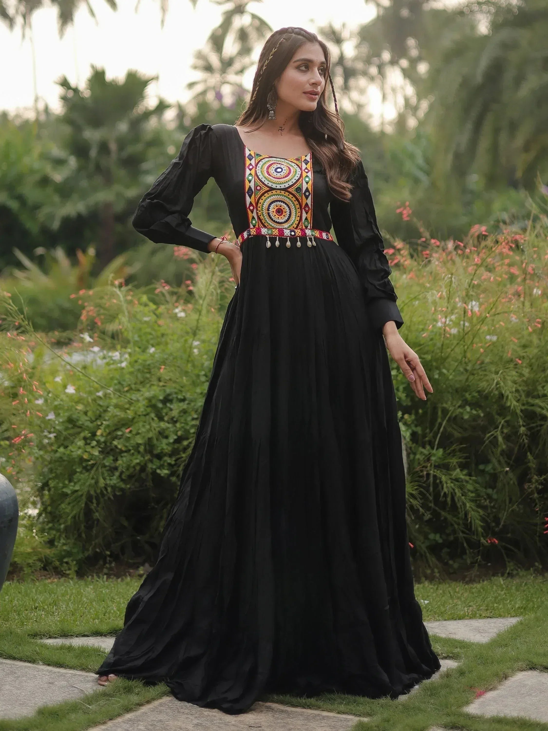 Black ethnic gown with colorful embroidery, long sleeves, and pleated skirt for women