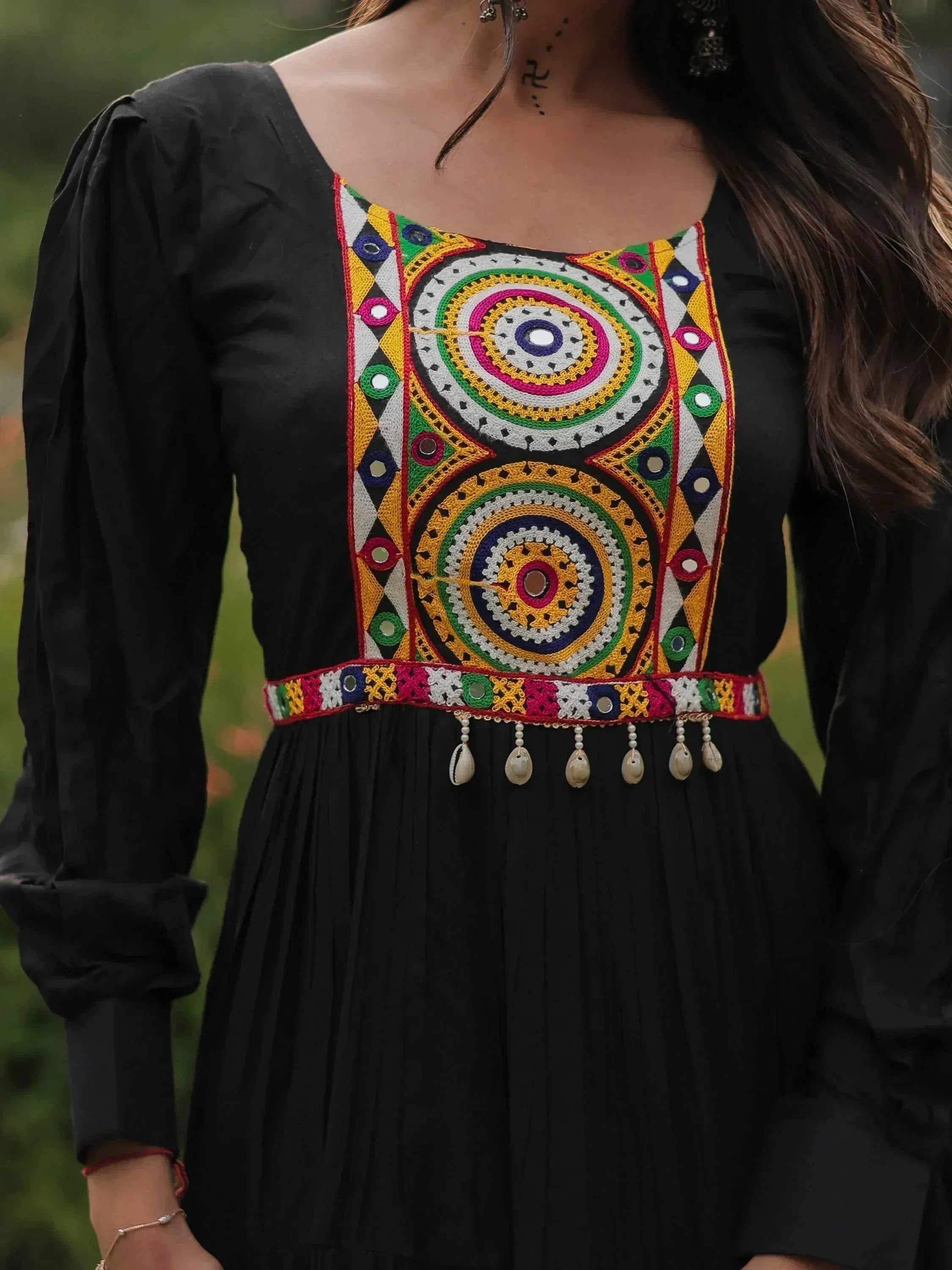 Black ethnic gown with vibrant mirror work and colorful embroidery, perfect for Indian festive wear.