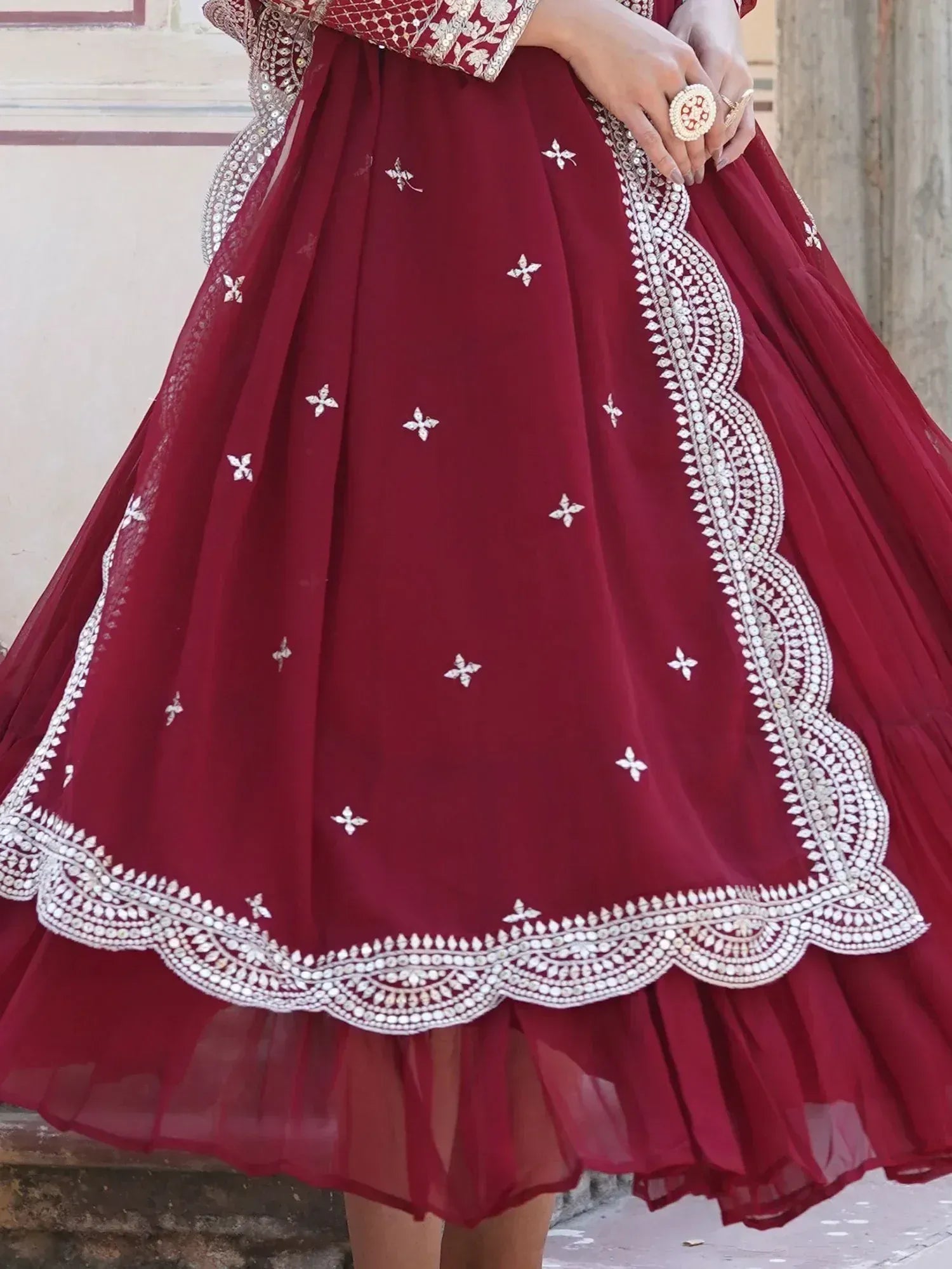 Maroon lehenga with white embroidered border and floral sequin details