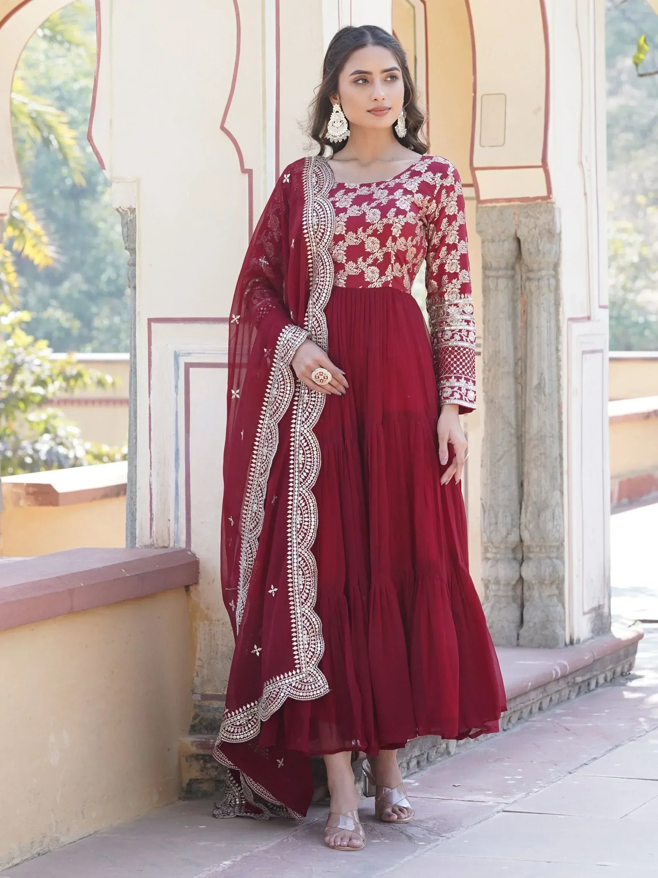 Woman in maroon embroidered Anarkali gown with dupatta, Indian ethnic wear