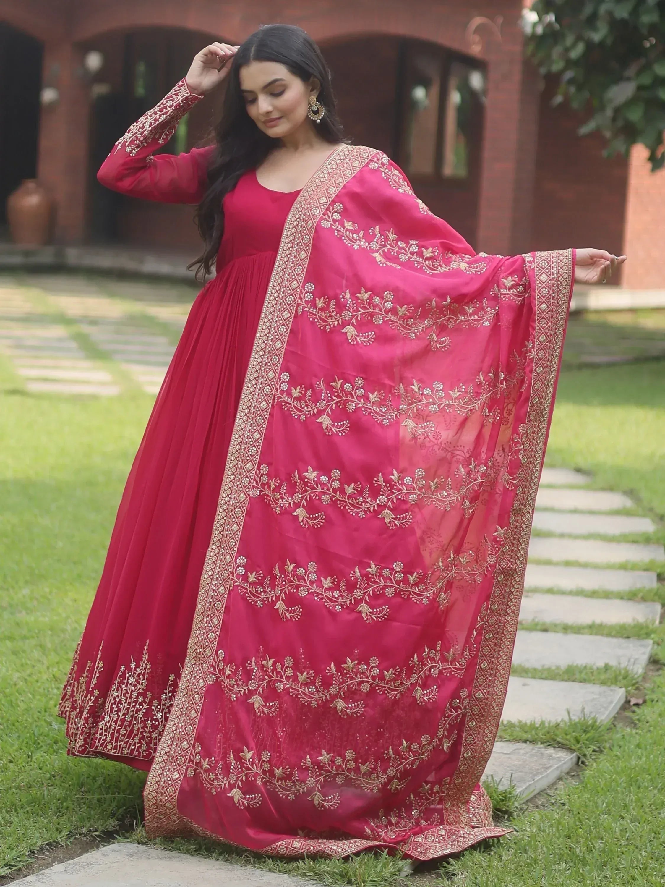 Woman in red embroidered anarkali with gold floral work, perfect for Indian ethnic occasions