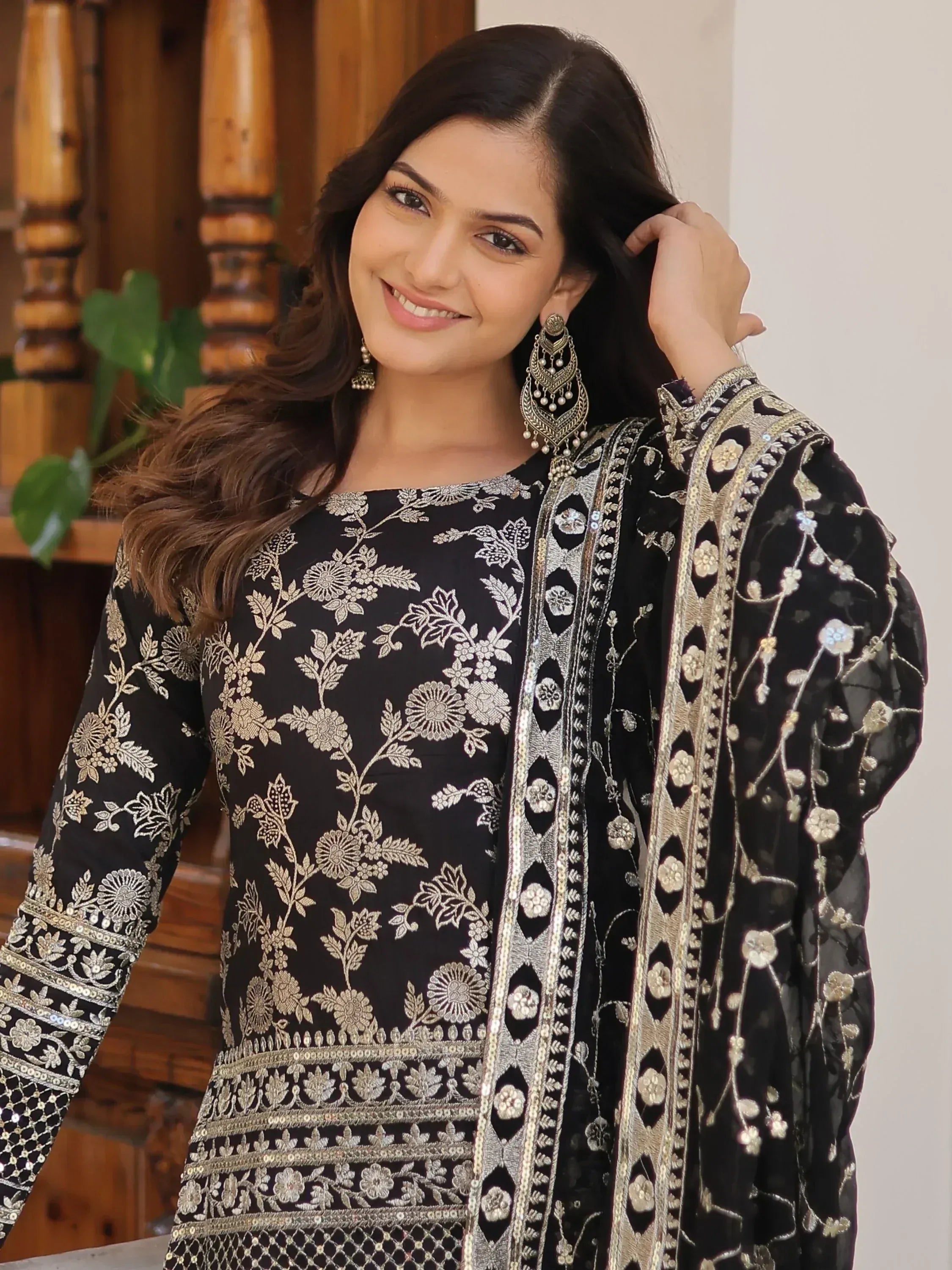 Black embroidered salwar kameez with gold floral work, perfect for Indian ethnic wear occasions