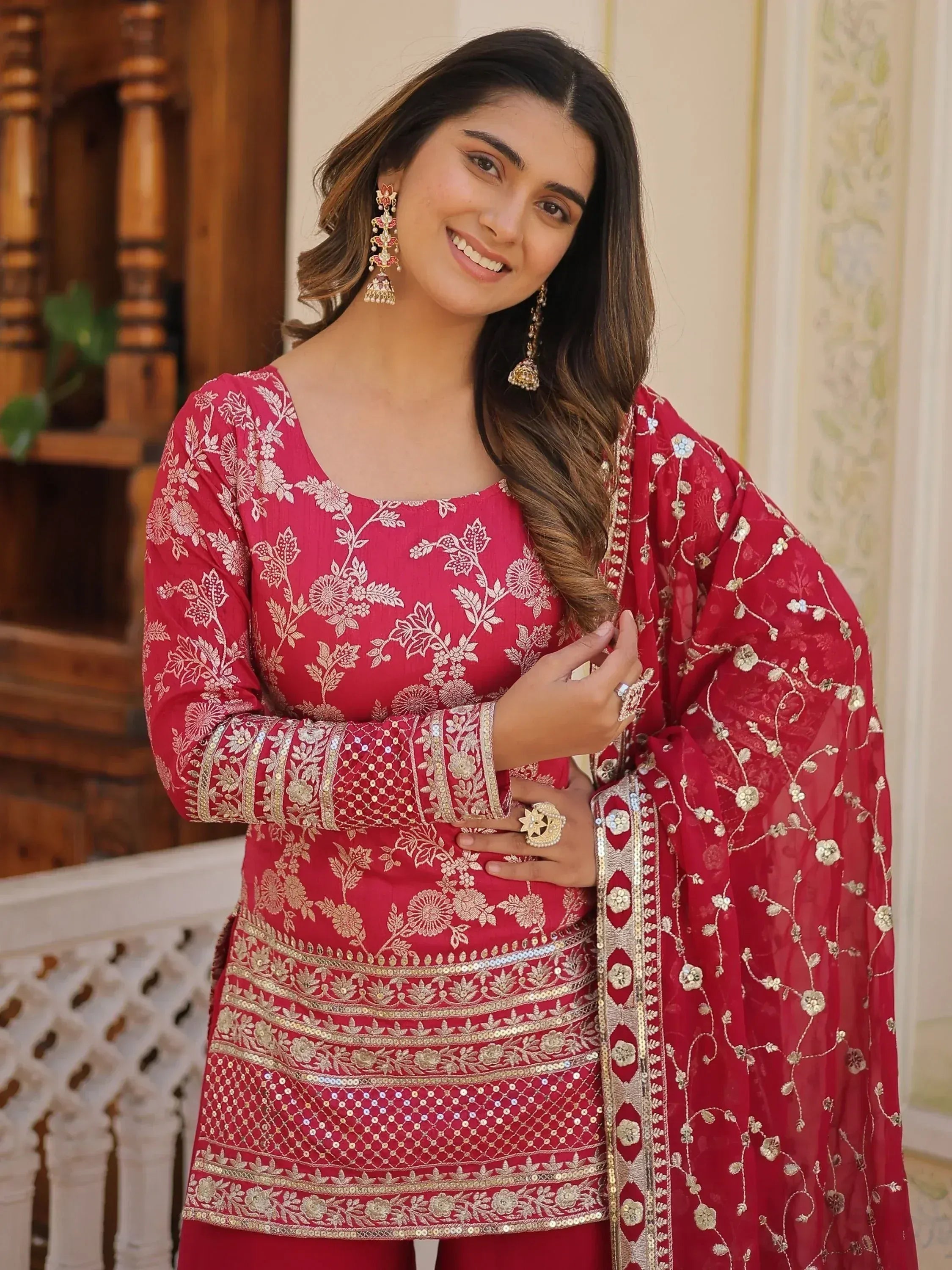 Red embroidered salwar kameez with gold floral detailing and matching dupatta