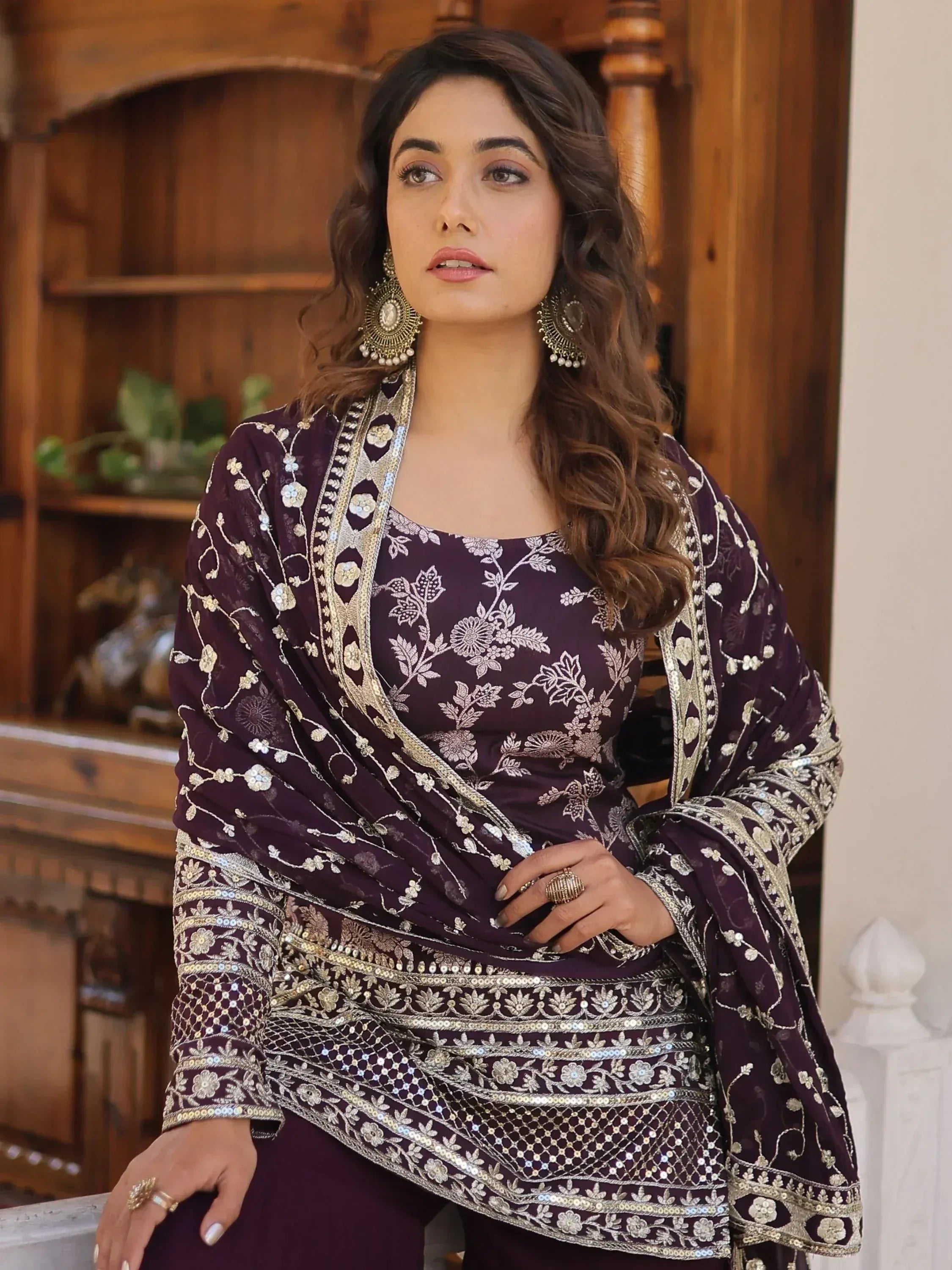 Elegant purple embroidered salwar kameez with gold detailing, perfect for ethnic occasions.
