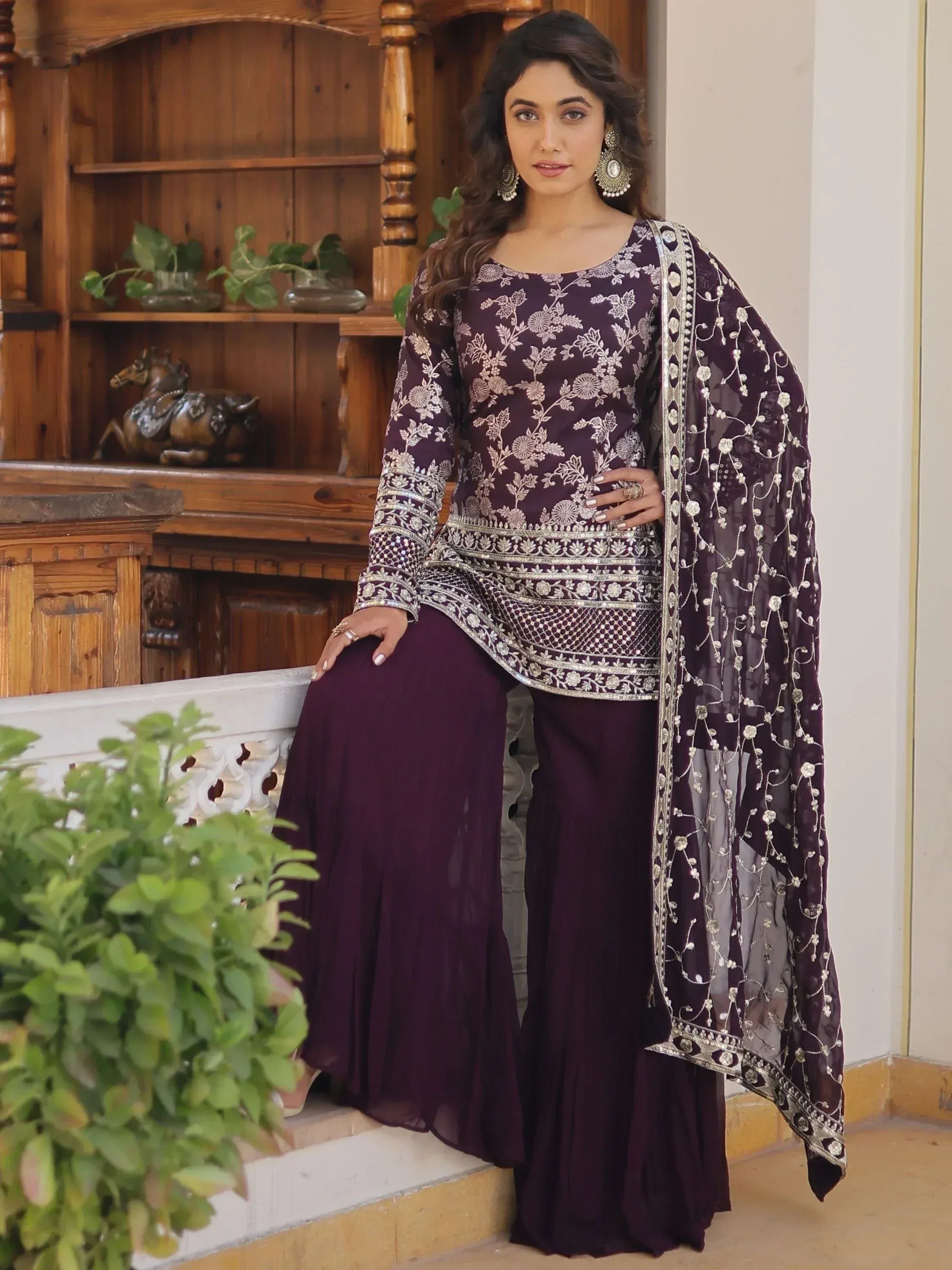 Elegant purple embroidered salwar kameez with floral designs and matching dupatta