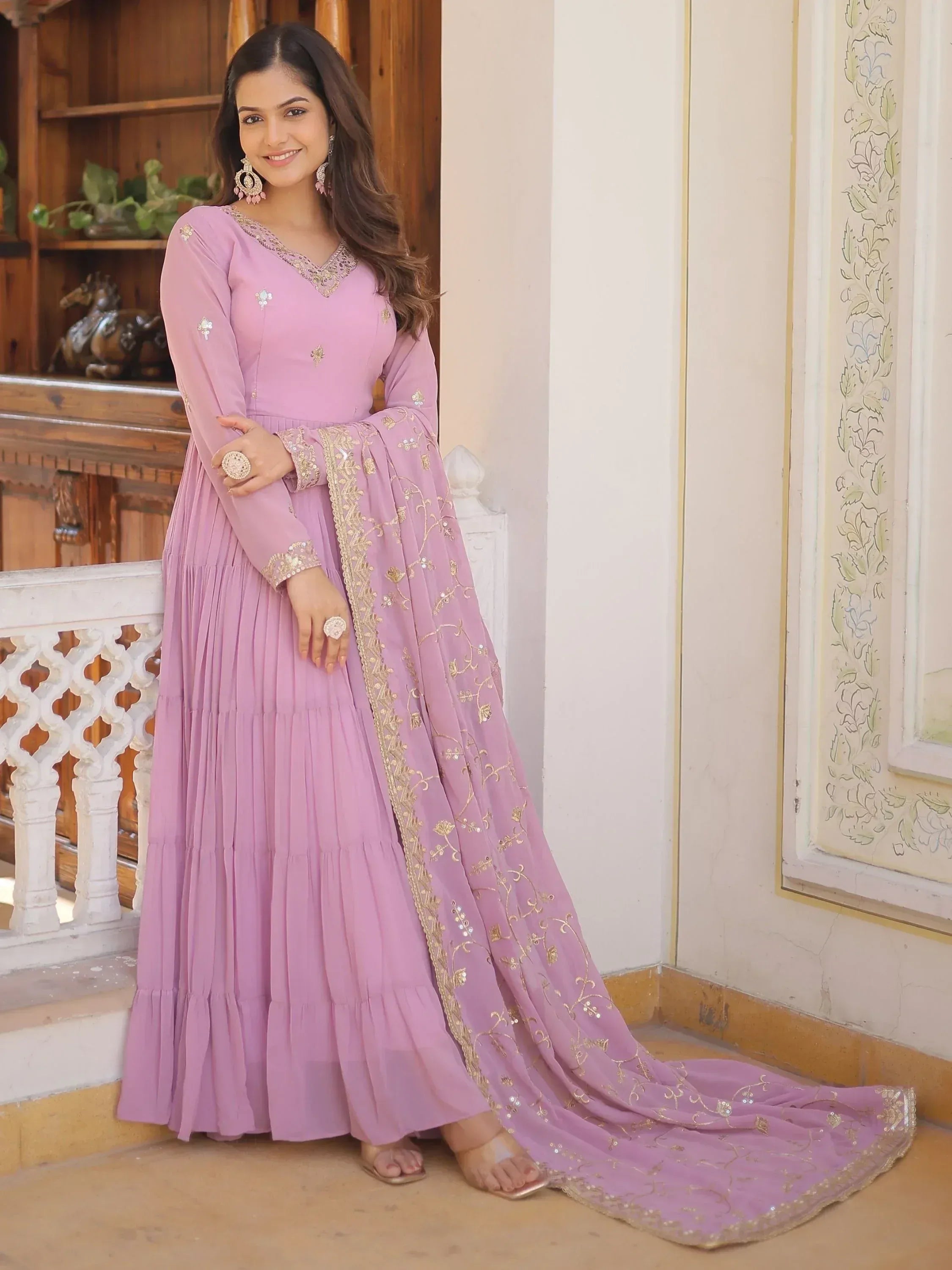Woman in a lavender embroidered Anarkali suit with dupatta, Indian ethnic wear