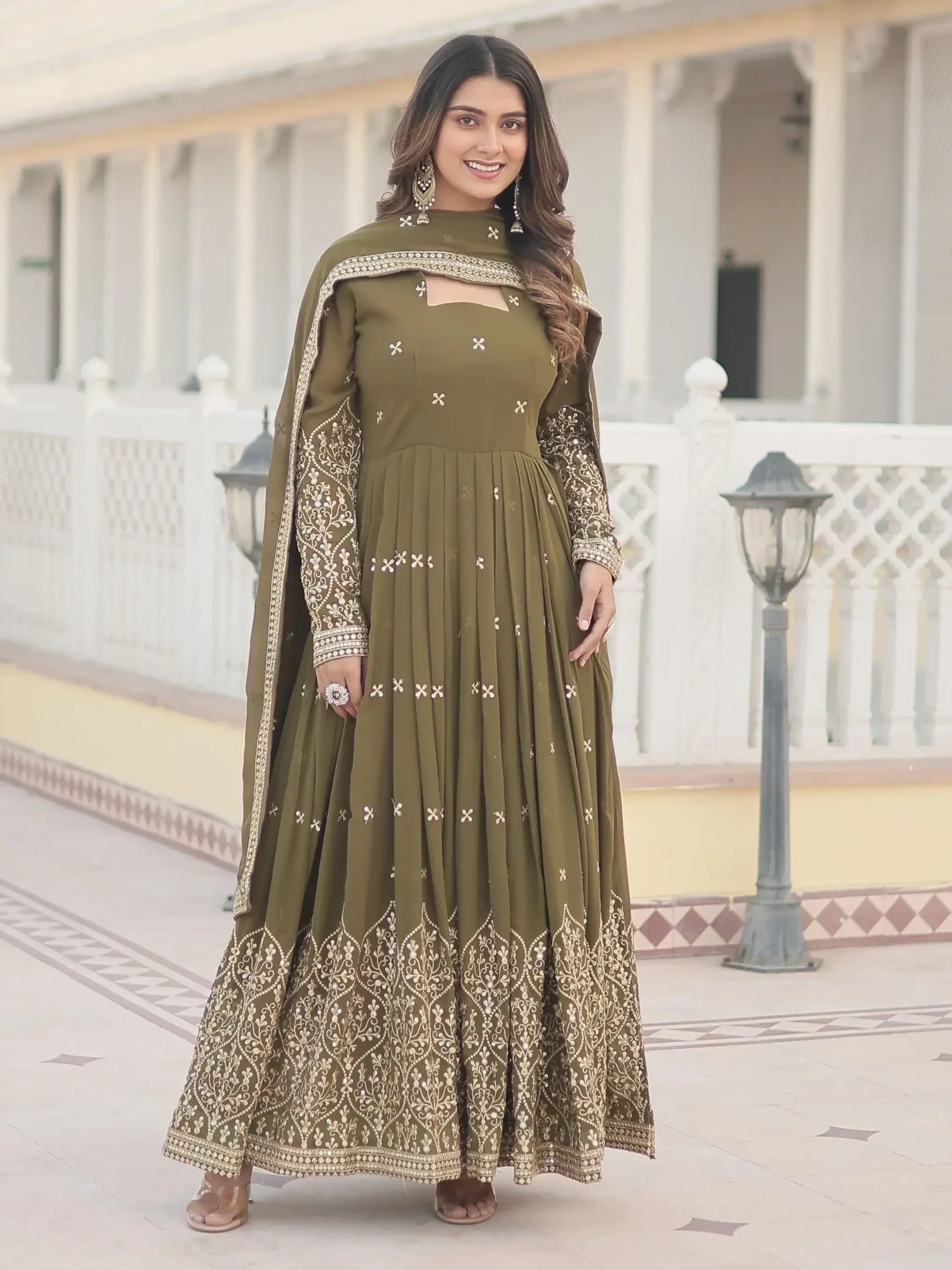 Olive green embroidered anarkali suit with gold detailing, perfect for Indian ethnic wear occasions.
