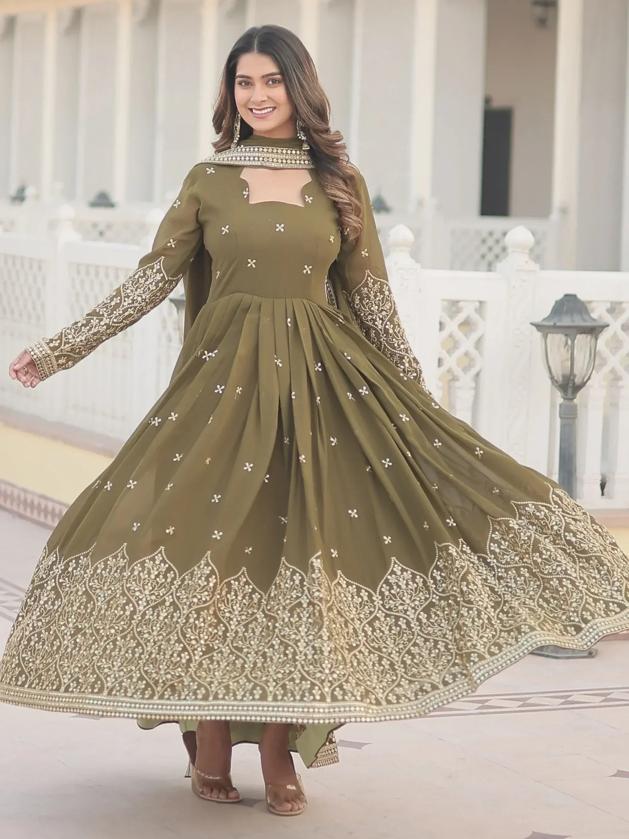 Olive green embroidered anarkali gown with gold detailing, perfect for Indian ethnic wear occasions.