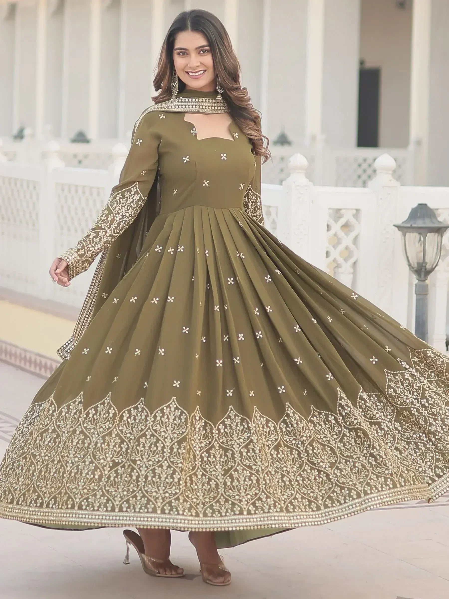 Olive green ethnic gown with gold embroidery, perfect for Indian occasions and festive wear.