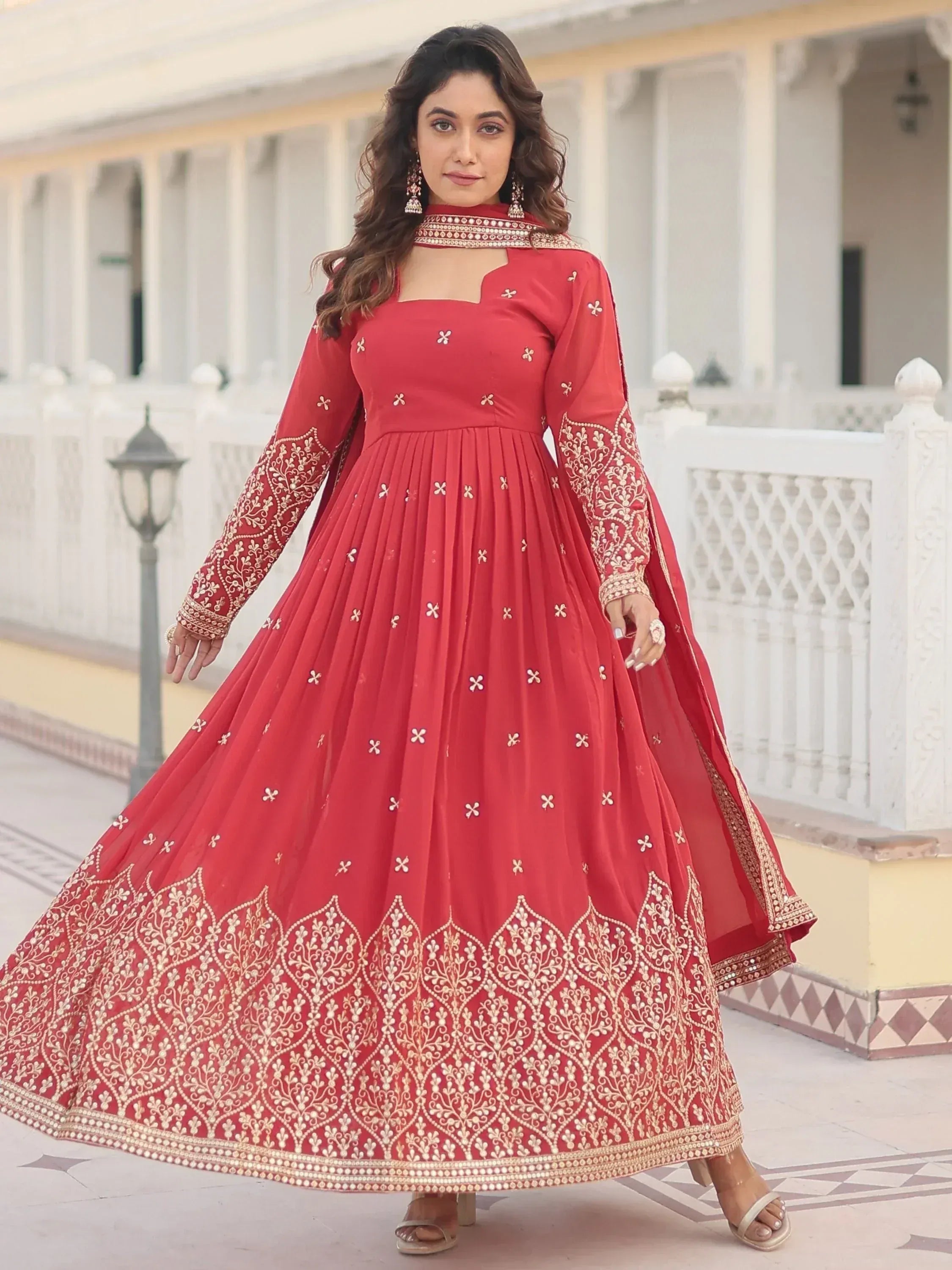 Red embroidered anarkali gown with gold detailing, perfect for Indian ethnic occasions and weddings.