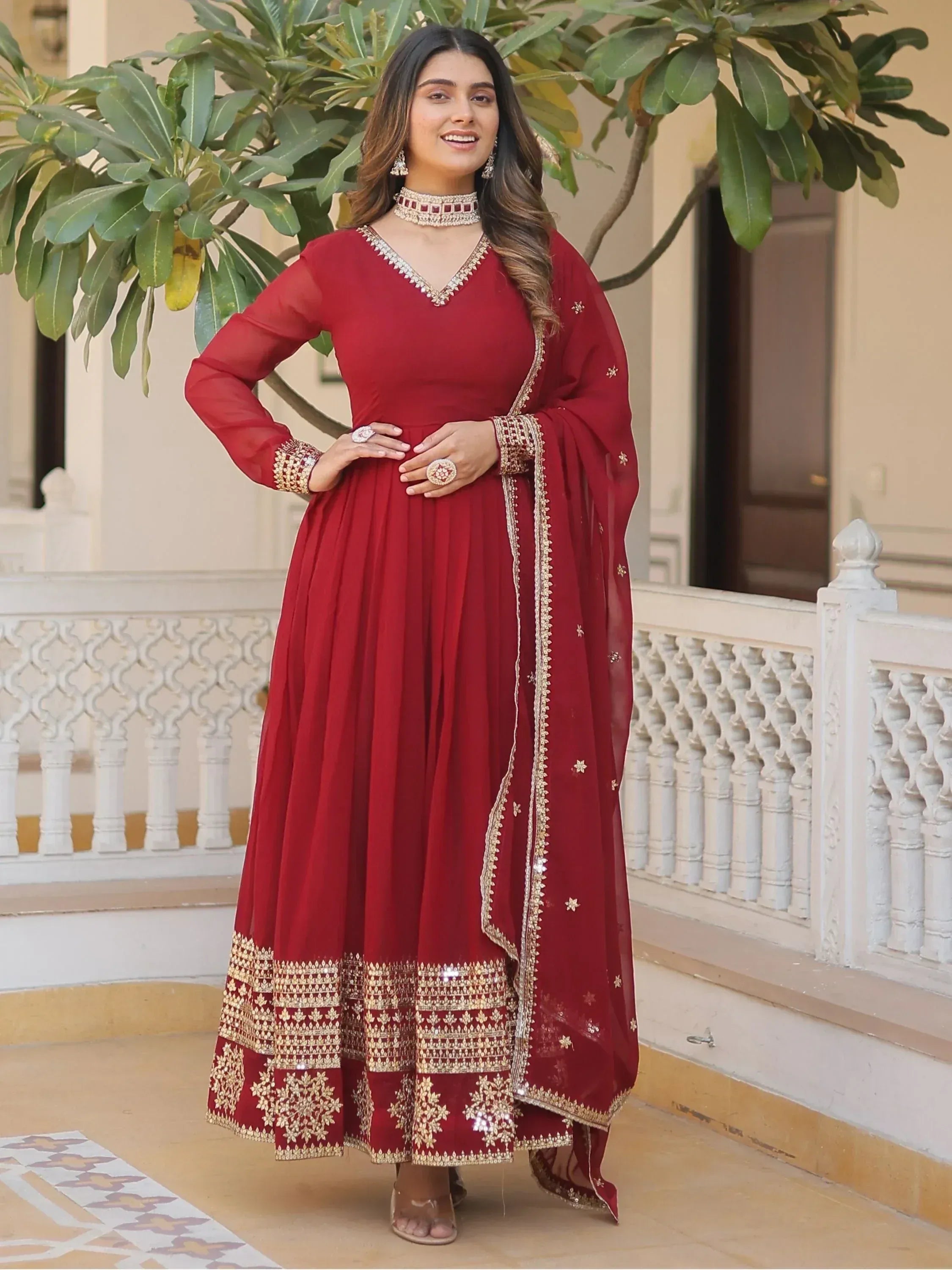 Maroon designer anarkali with gold embroidery, perfect for Indian ethnic wear and festive occasions.