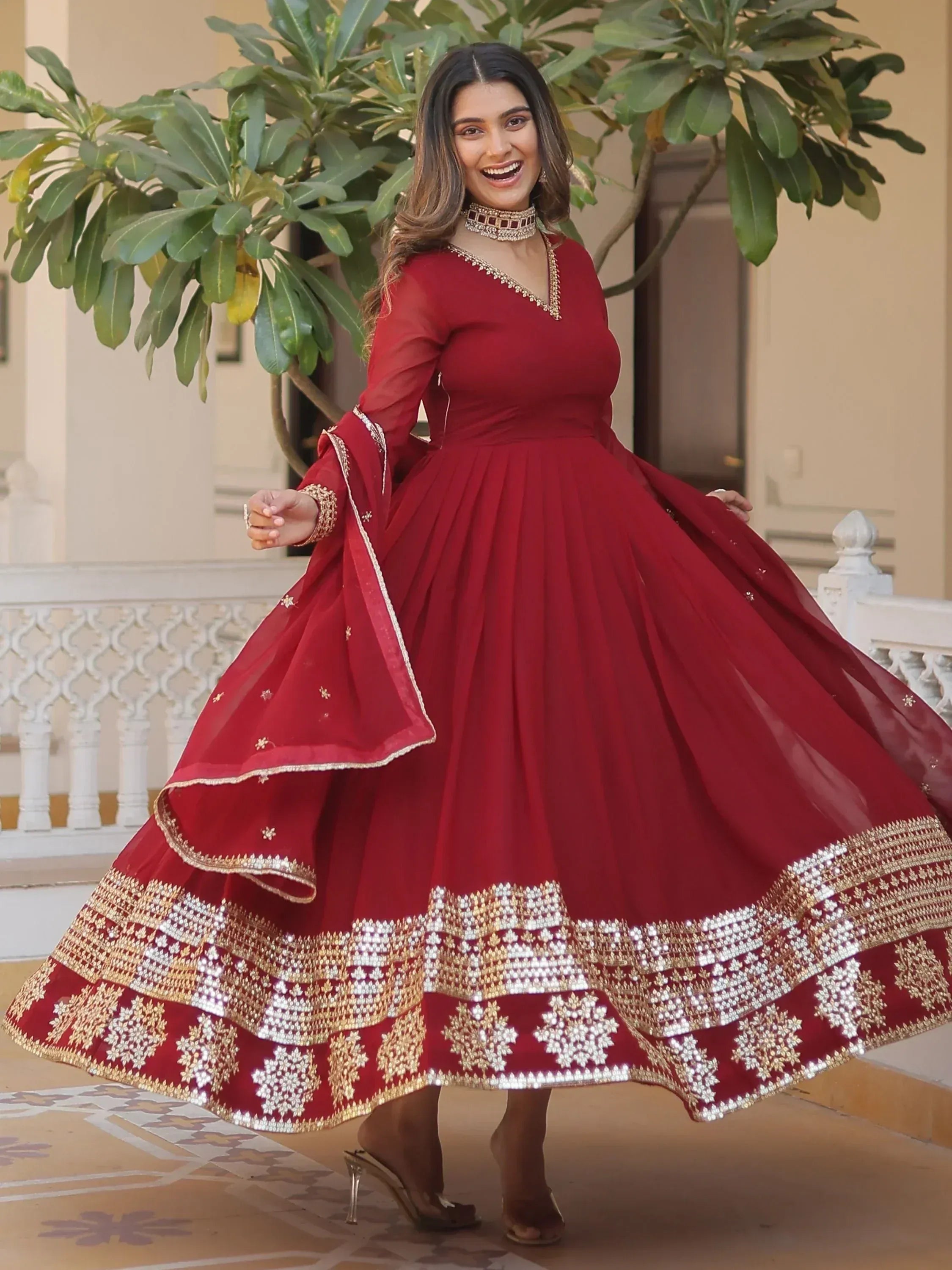 Red designer lehenga choli with gold embroidery, perfect for Indian ethnic wear and festive occasions.