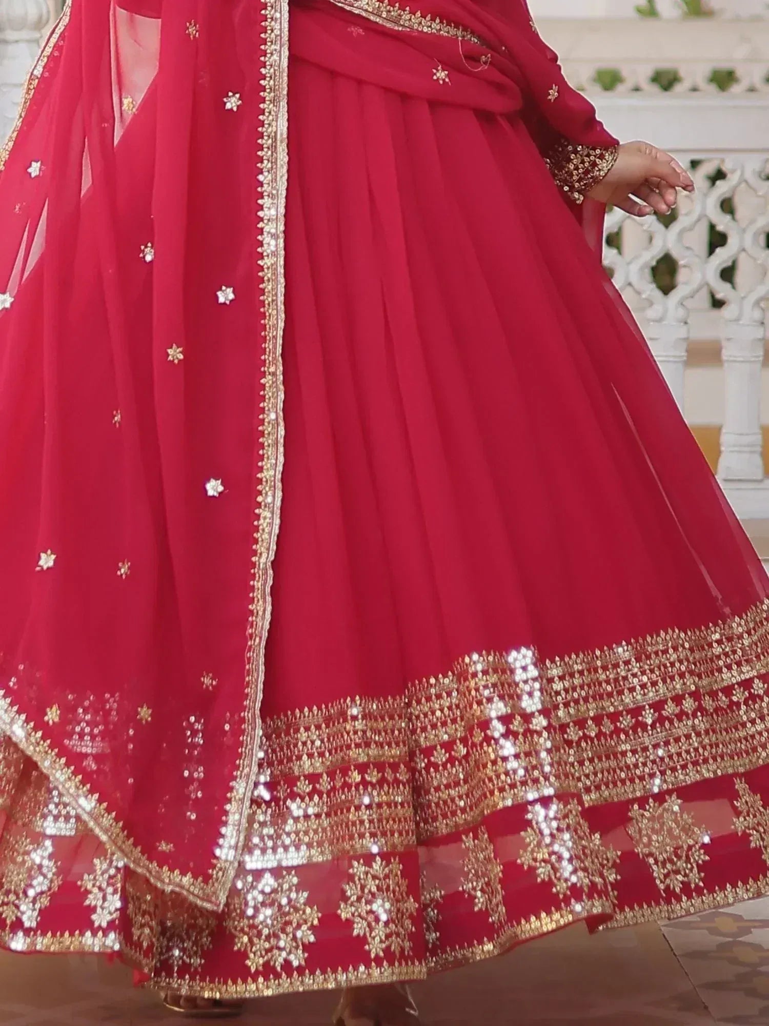 Red designer lehenga choli with gold embroidery and sequin work, perfect for Indian ethnic wear occasions