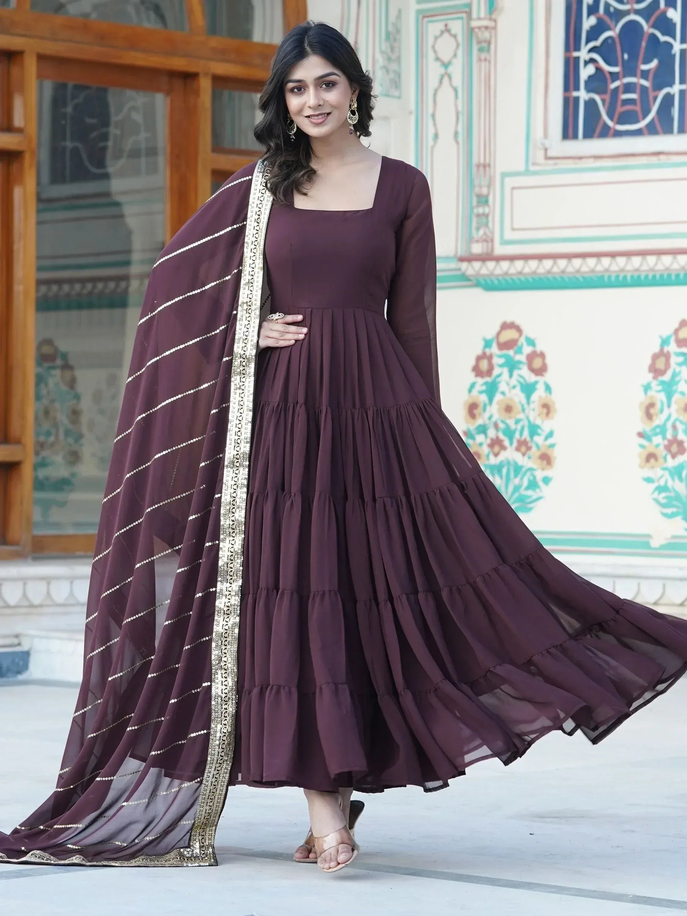 Woman in brown flared ethnic gown with dupatta, traditional Indian party wear