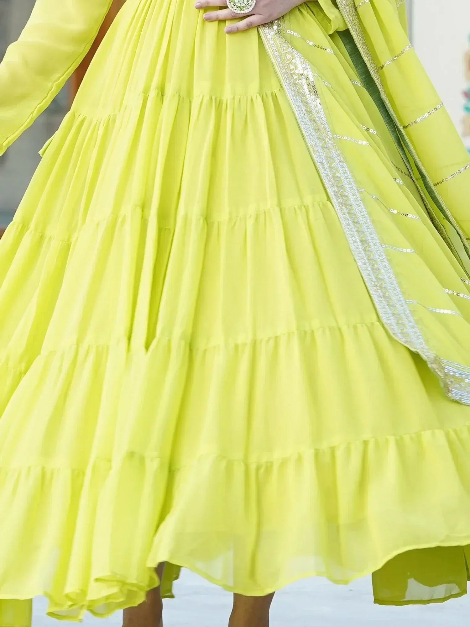 Bright yellow tiered ethnic gown with sequin dupatta, perfect for festive occasions and Indian celebrations