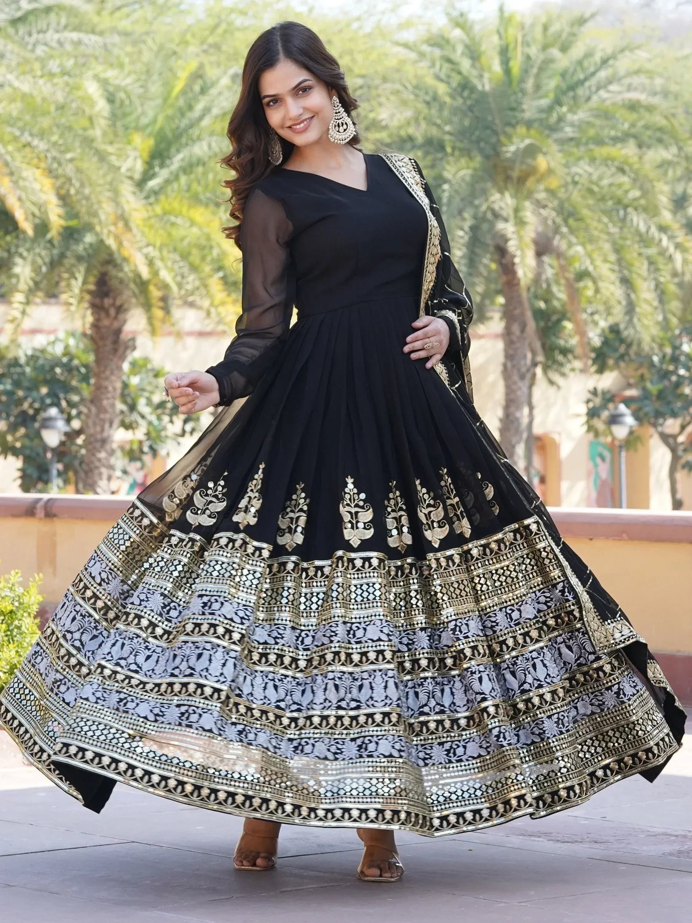 Black and gold embroidered anarkali gown with sheer sleeves, perfect for Indian ethnic occasions