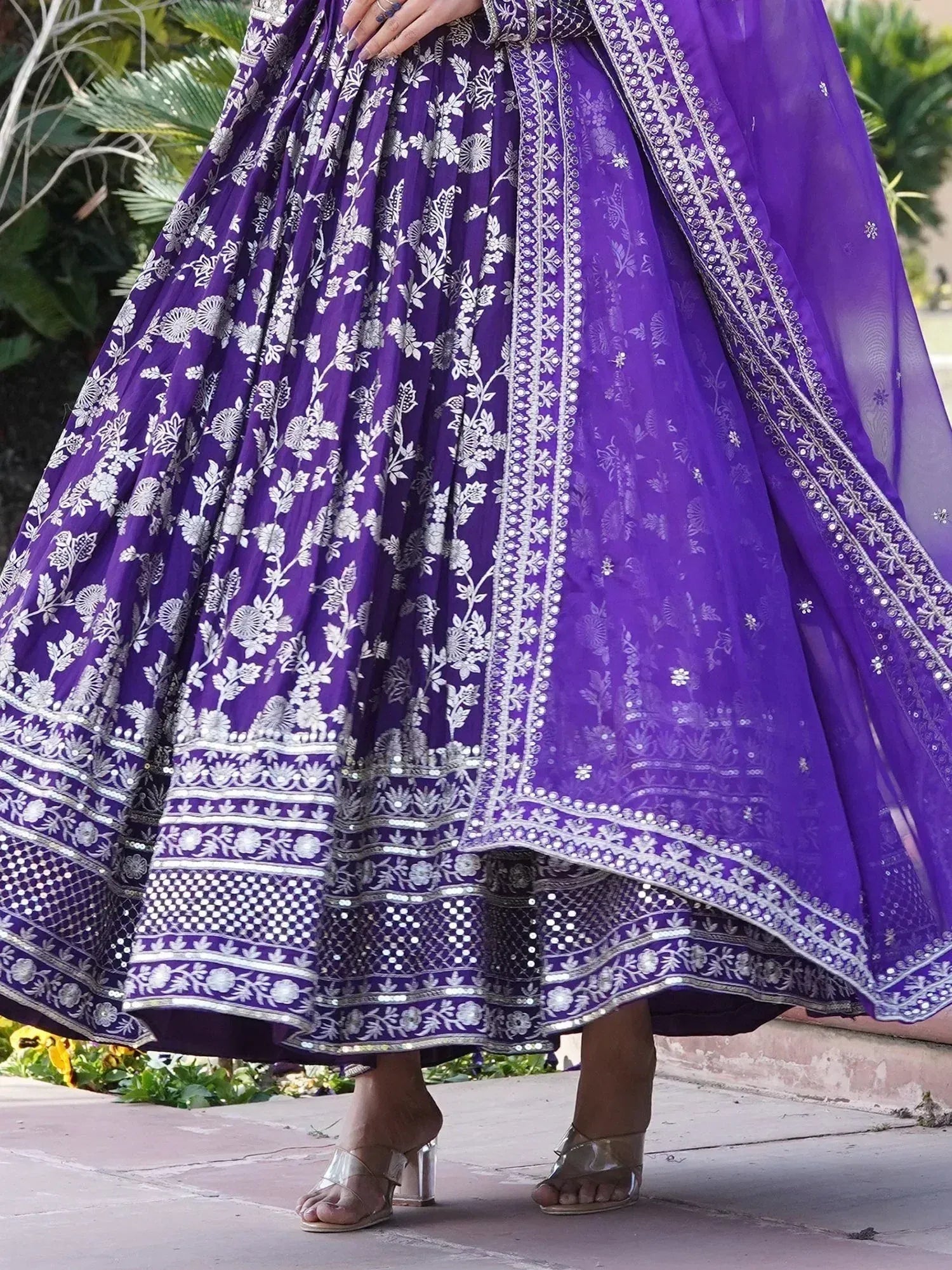 Purple embroidered lehenga choli with silver floral patterns and sheer dupatta