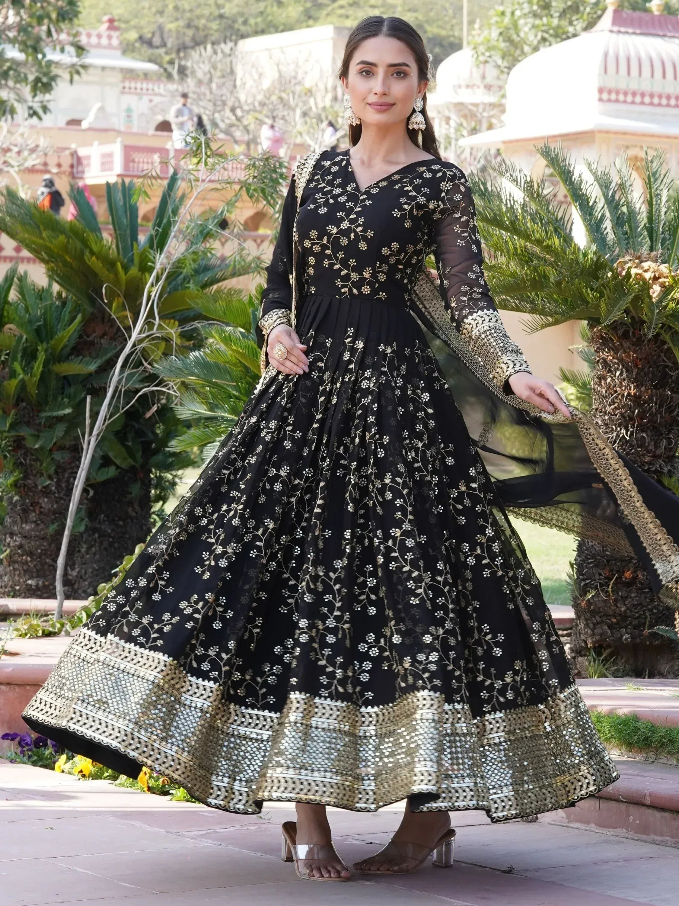 Black and gold embroidered anarkali suit with floral motifs, perfect for Indian ethnic occasions