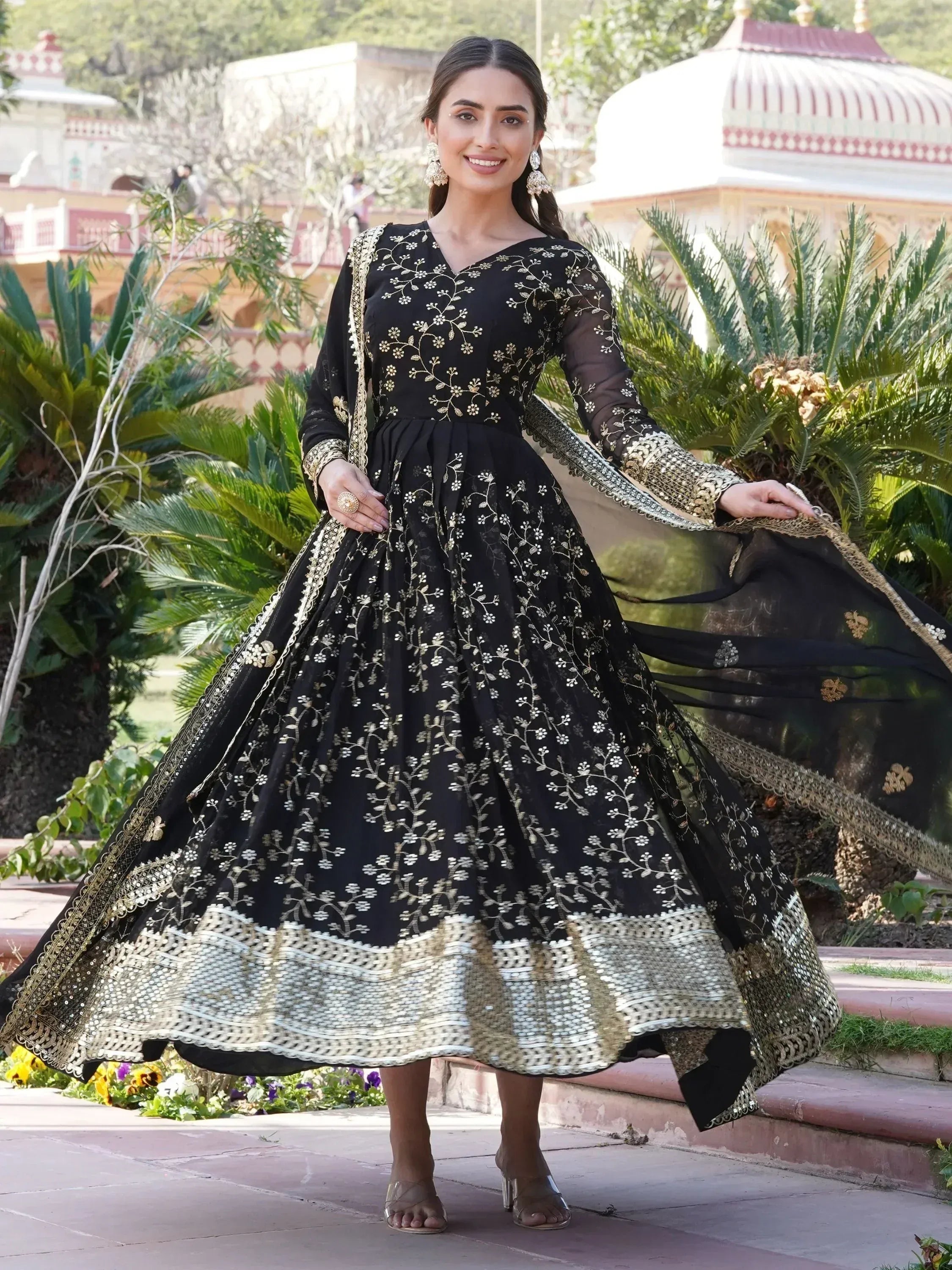 Black and gold embroidered anarkali suit with floral detailing, perfect for Indian ethnic occasions