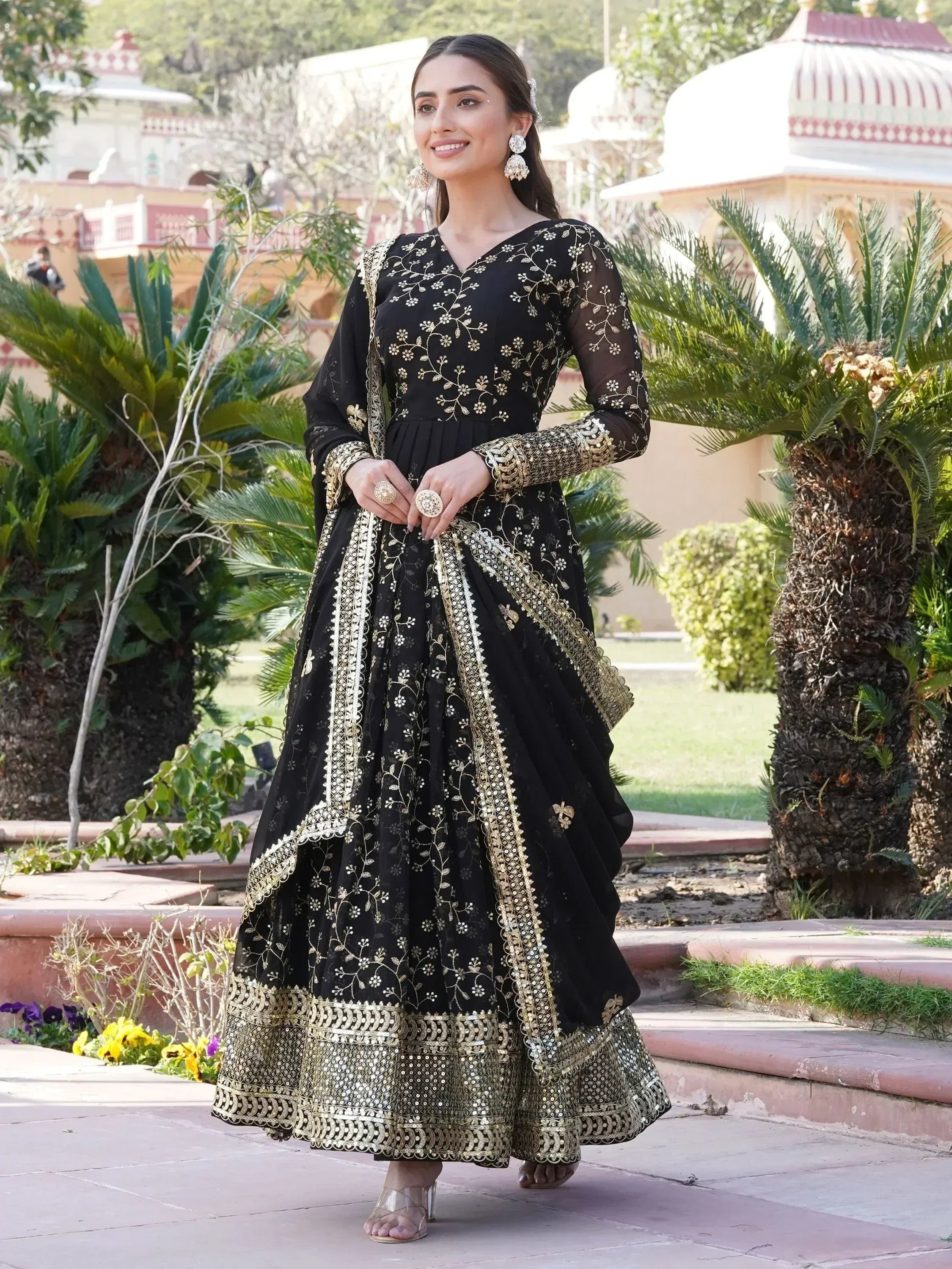 Black and gold embroidered anarkali suit with floral detailing, perfect for Indian ethnic wear occasions.