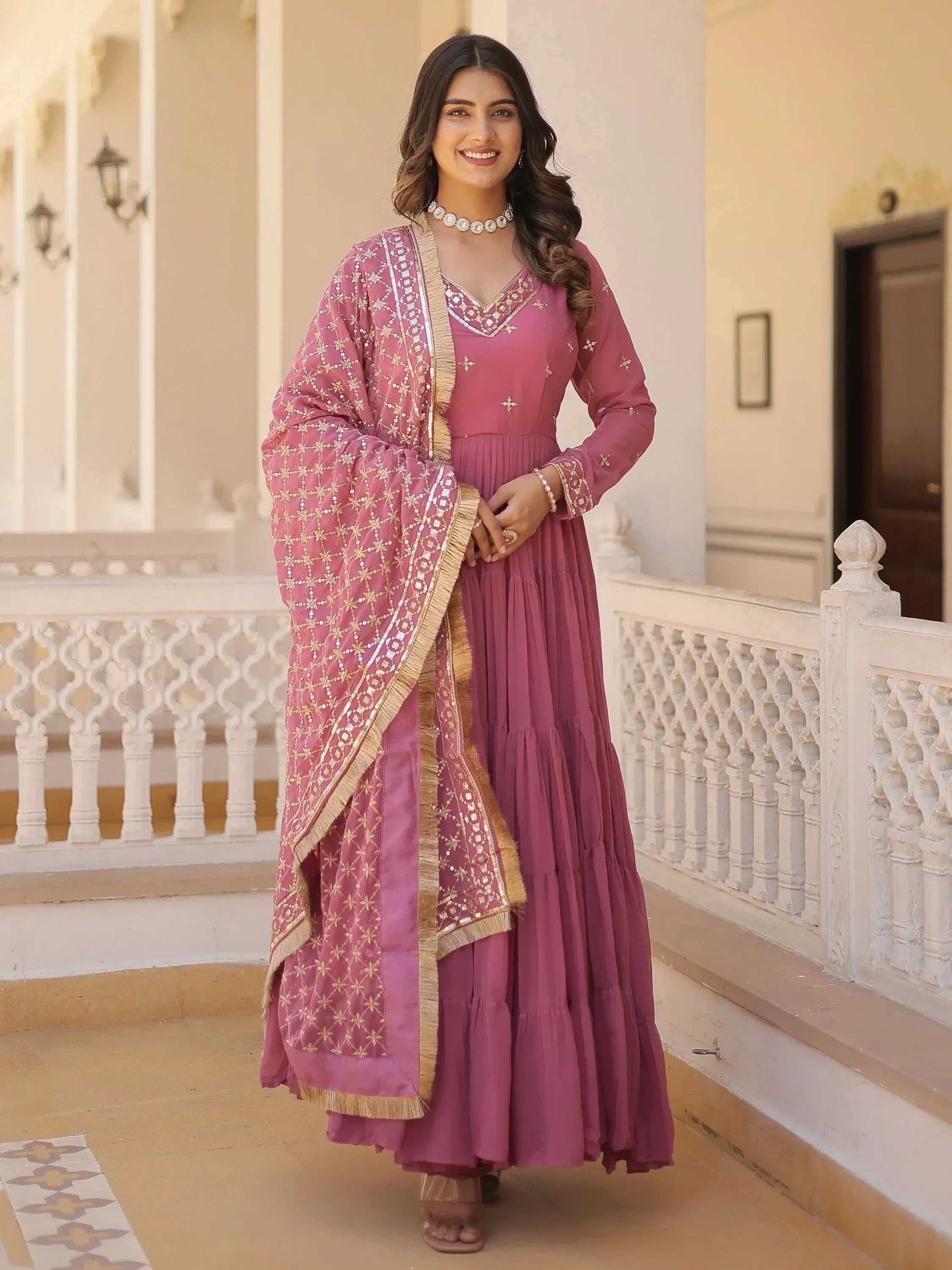 Pink embroidered ethnic gown with matching dupatta, perfect for Indian occasions and festive wear