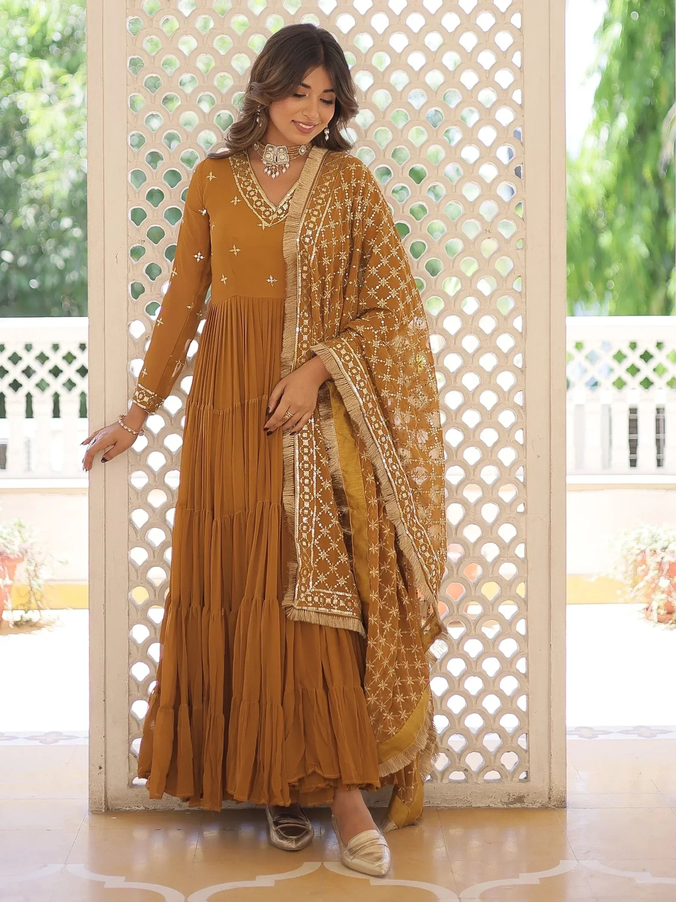 Mustard ethnic anarkali gown with gold embroidery and dupatta, perfect for Indian occasions