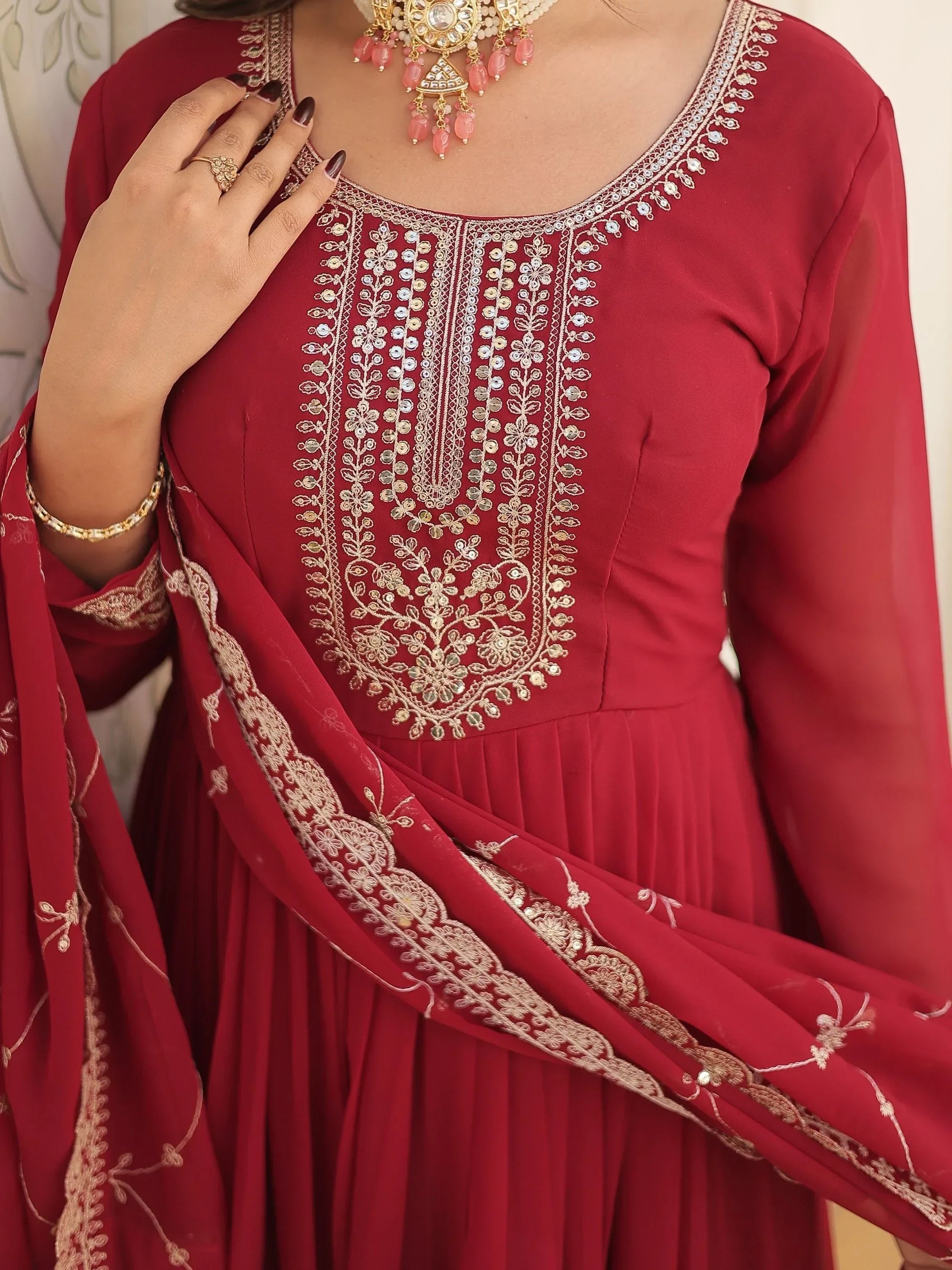 Maroon ethnic gown with gold embroidery and matching dupatta, traditional Indian attire