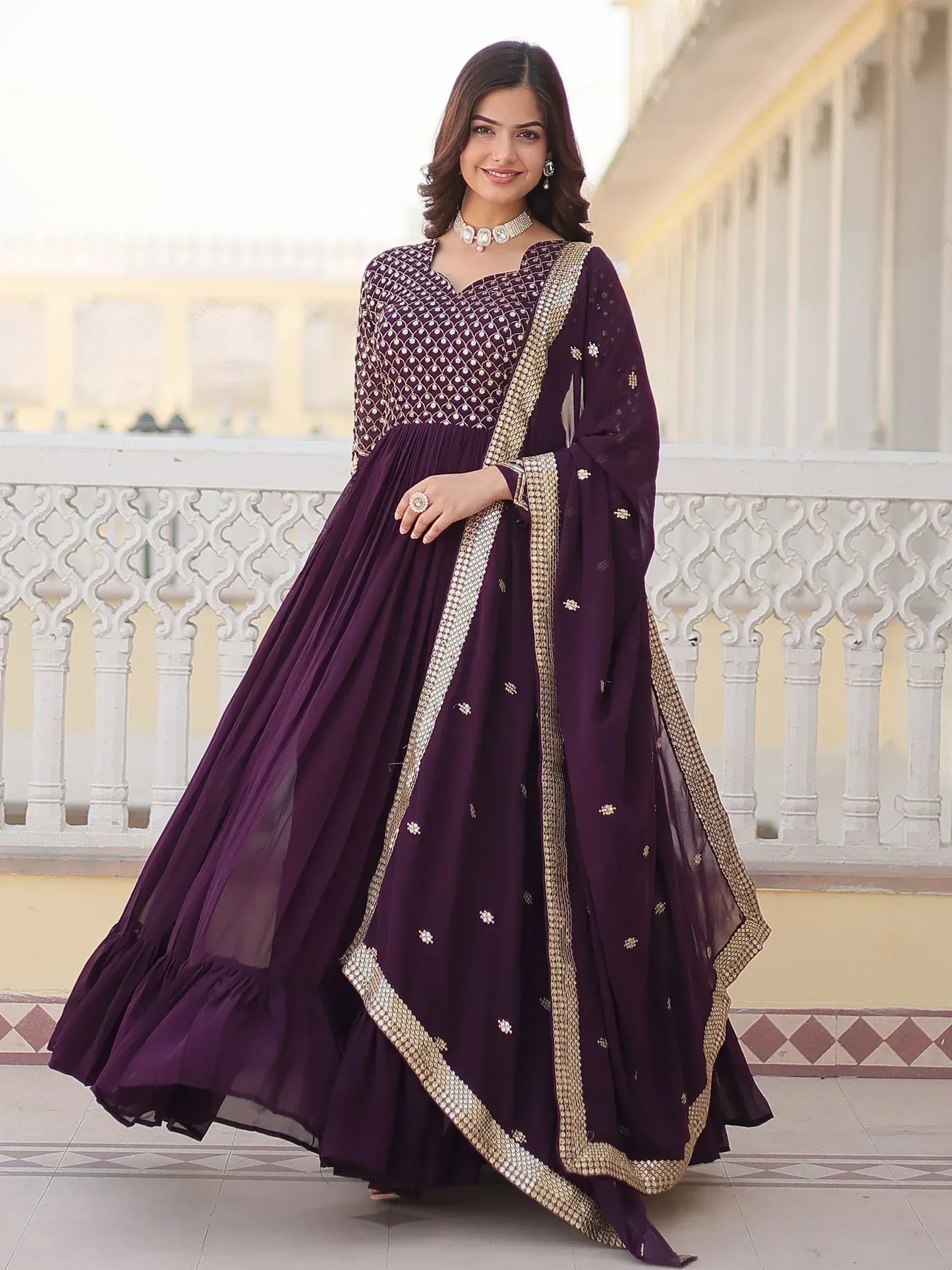 Elegant purple designer anarkali suit with gold embroidery, perfect for Indian ethnic occasions