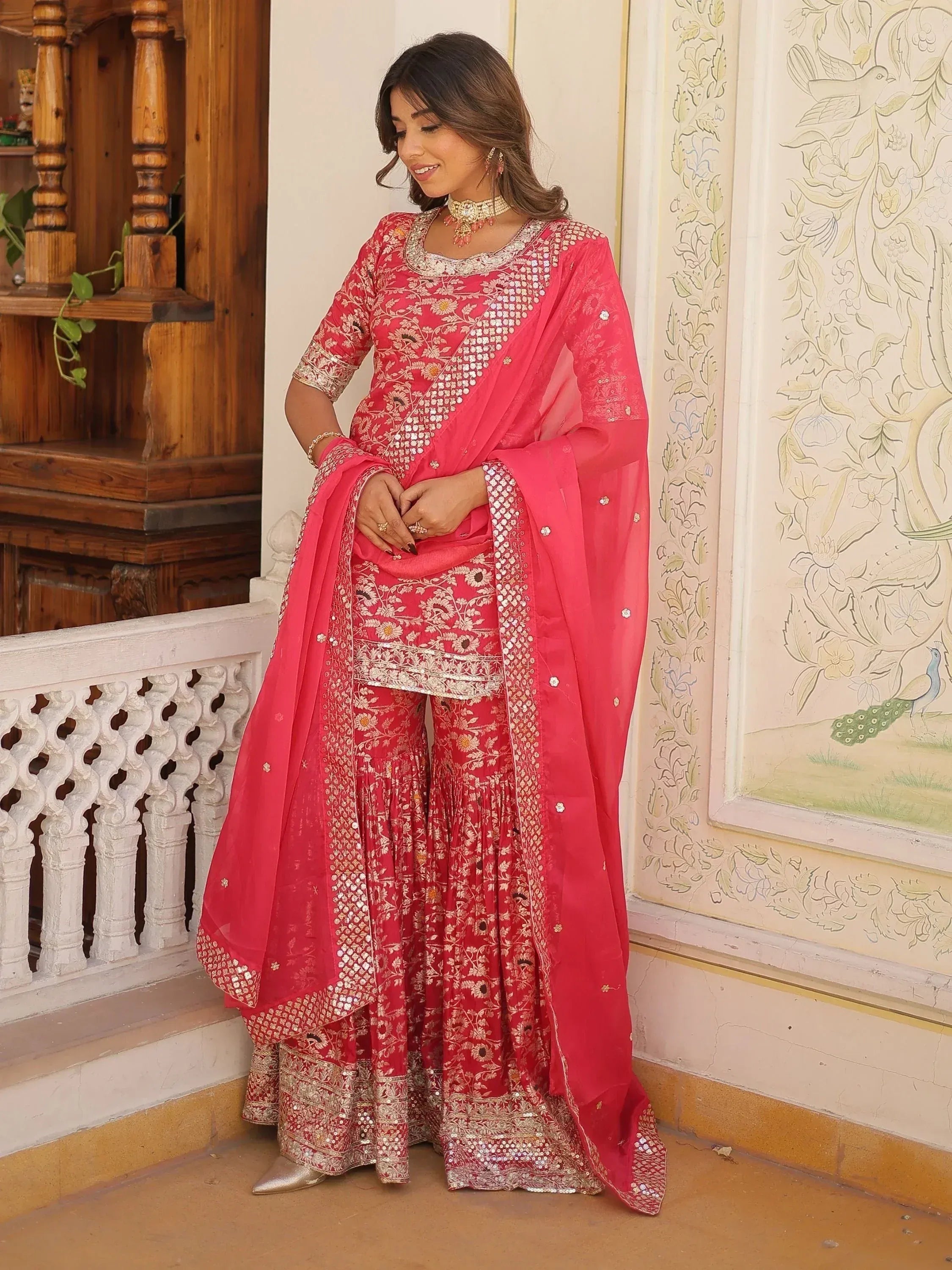 Pink embroidered salwar kameez with floral mirror work, perfect for Indian ethnic wear occasions