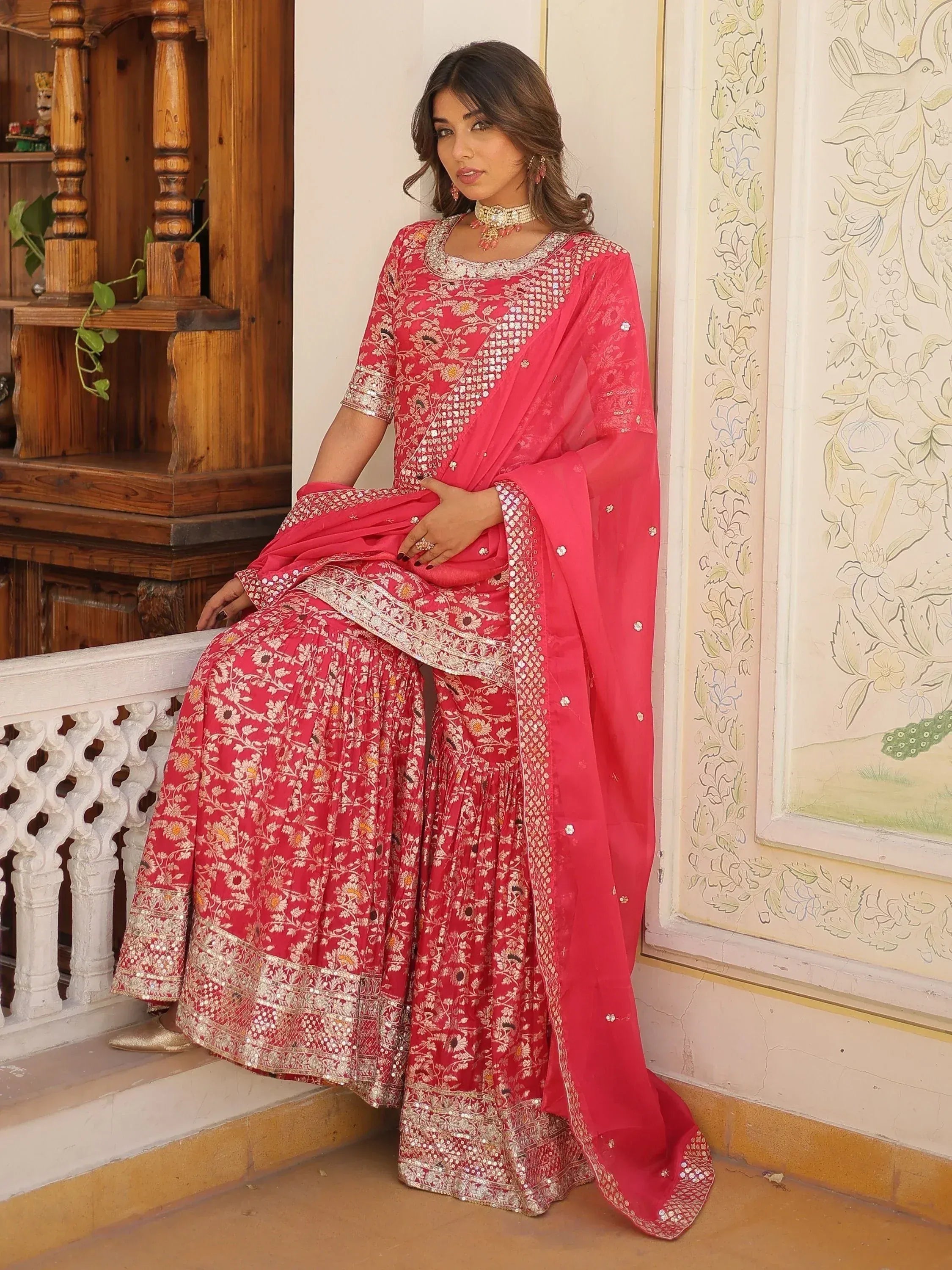 Pink floral embroidered lehenga choli with mirror work, perfect for Indian weddings and festive occasions