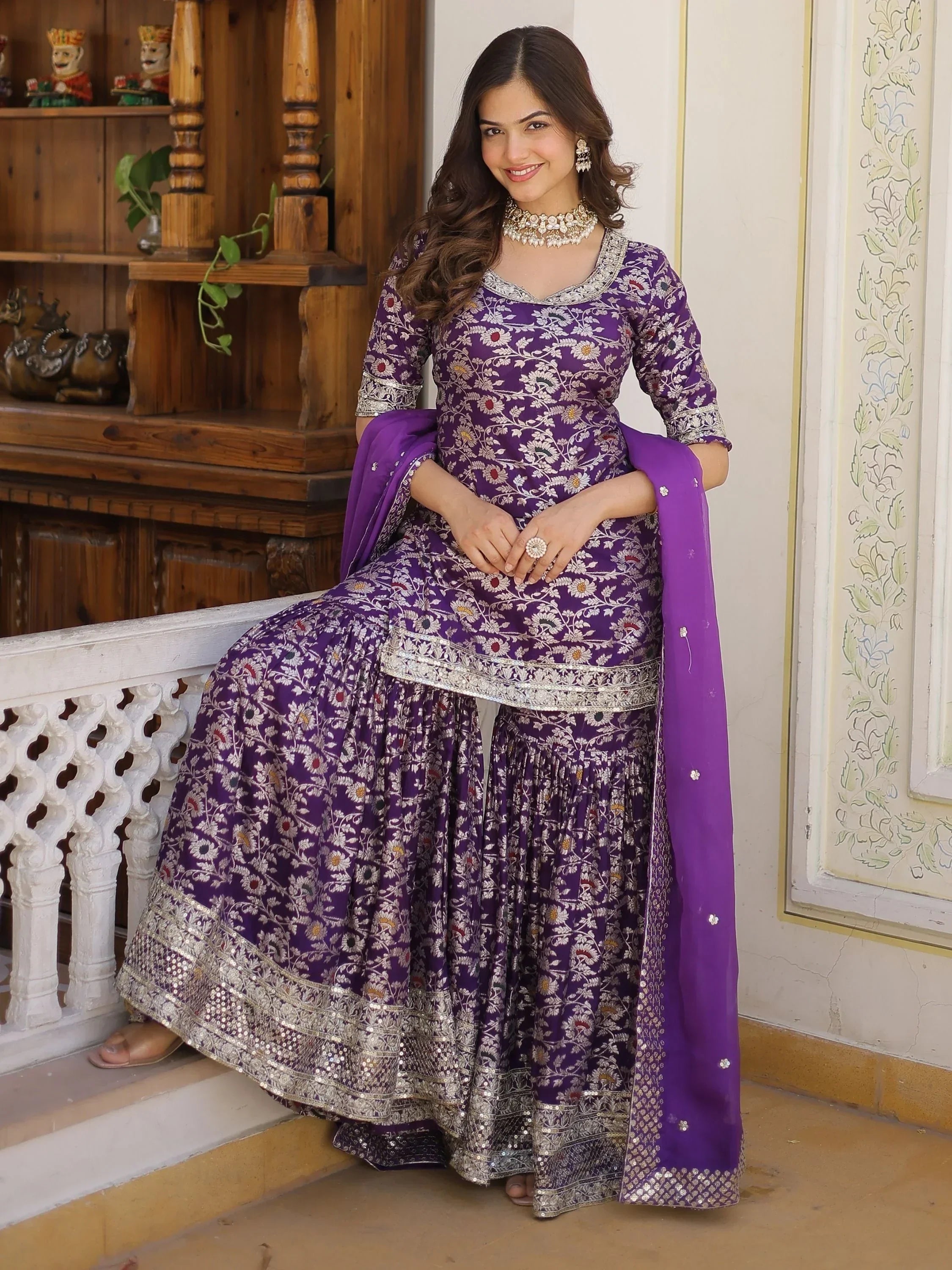 Woman in purple floral printed lehenga choli with embroidery, traditional Indian ethnic wear