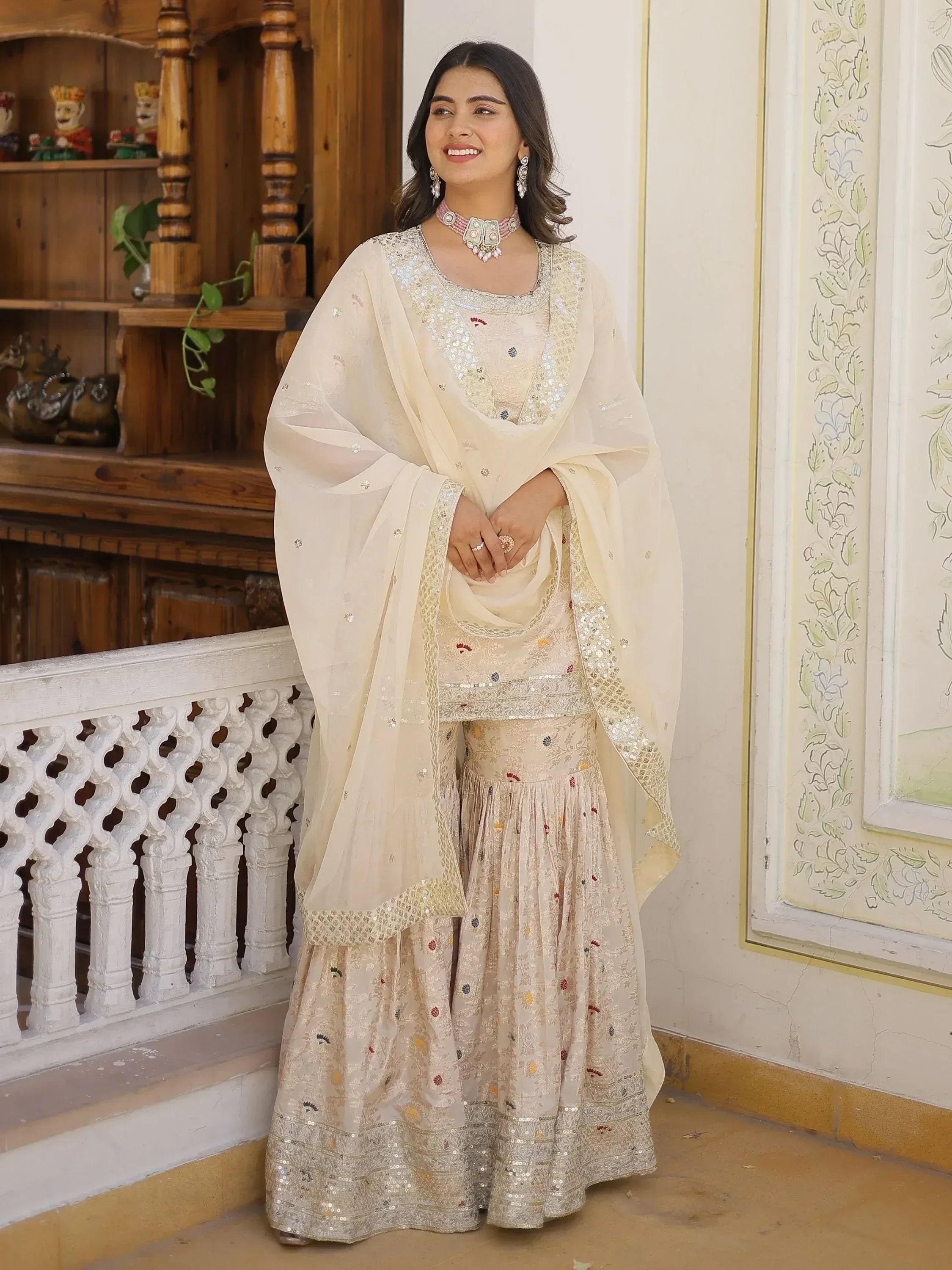 Cream embroidered sharara suit with sequin work, perfect for Indian ethnic occasions