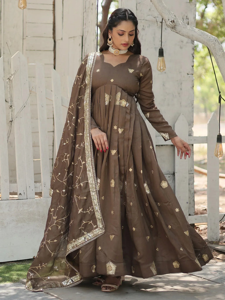 Brown ethnic anarkali gown with gold embroidery and dupatta, perfect for Indian occasions