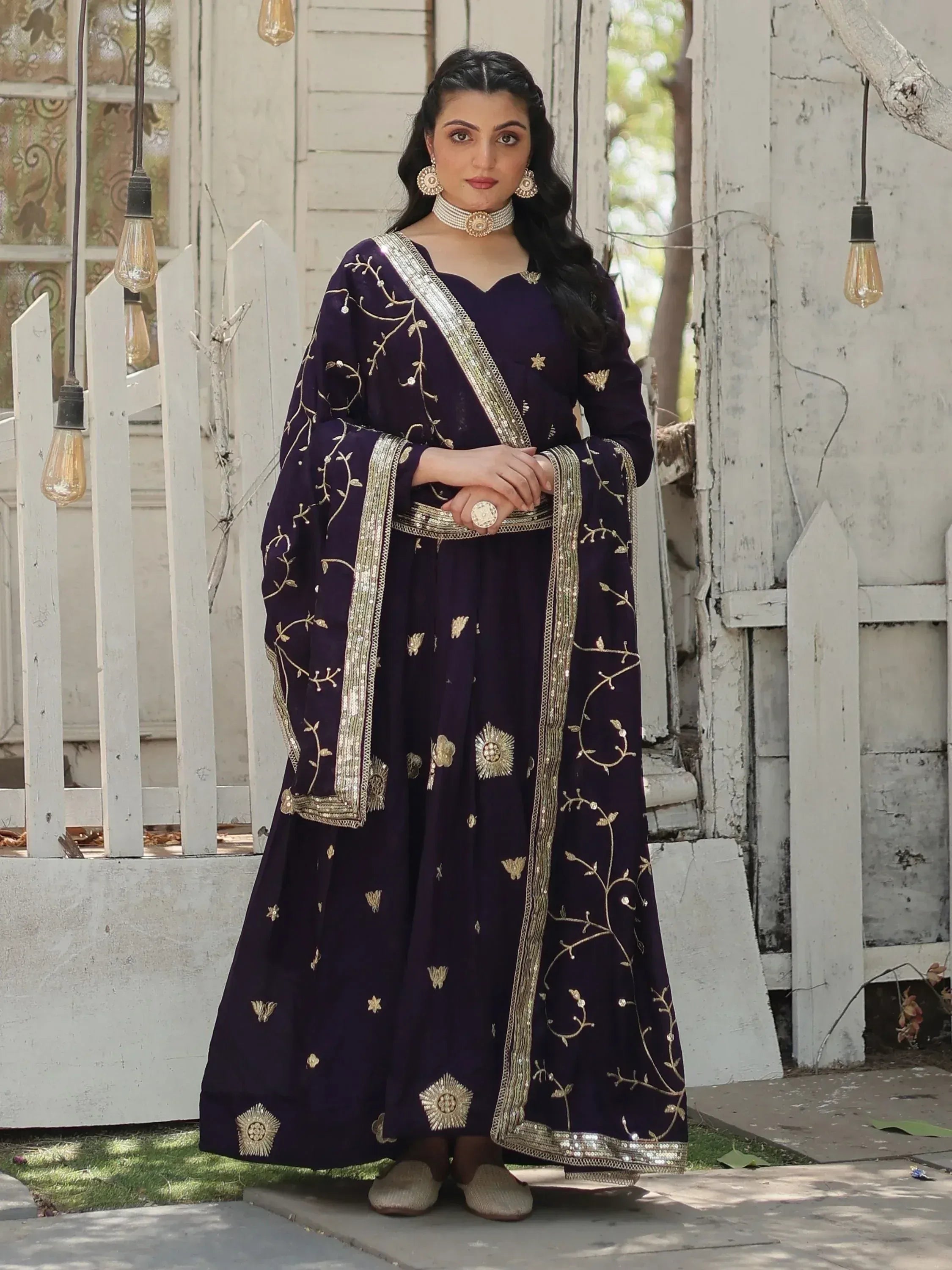 Purple Indian ethnic gown with gold embroidery, perfect for festive occasions and weddings.