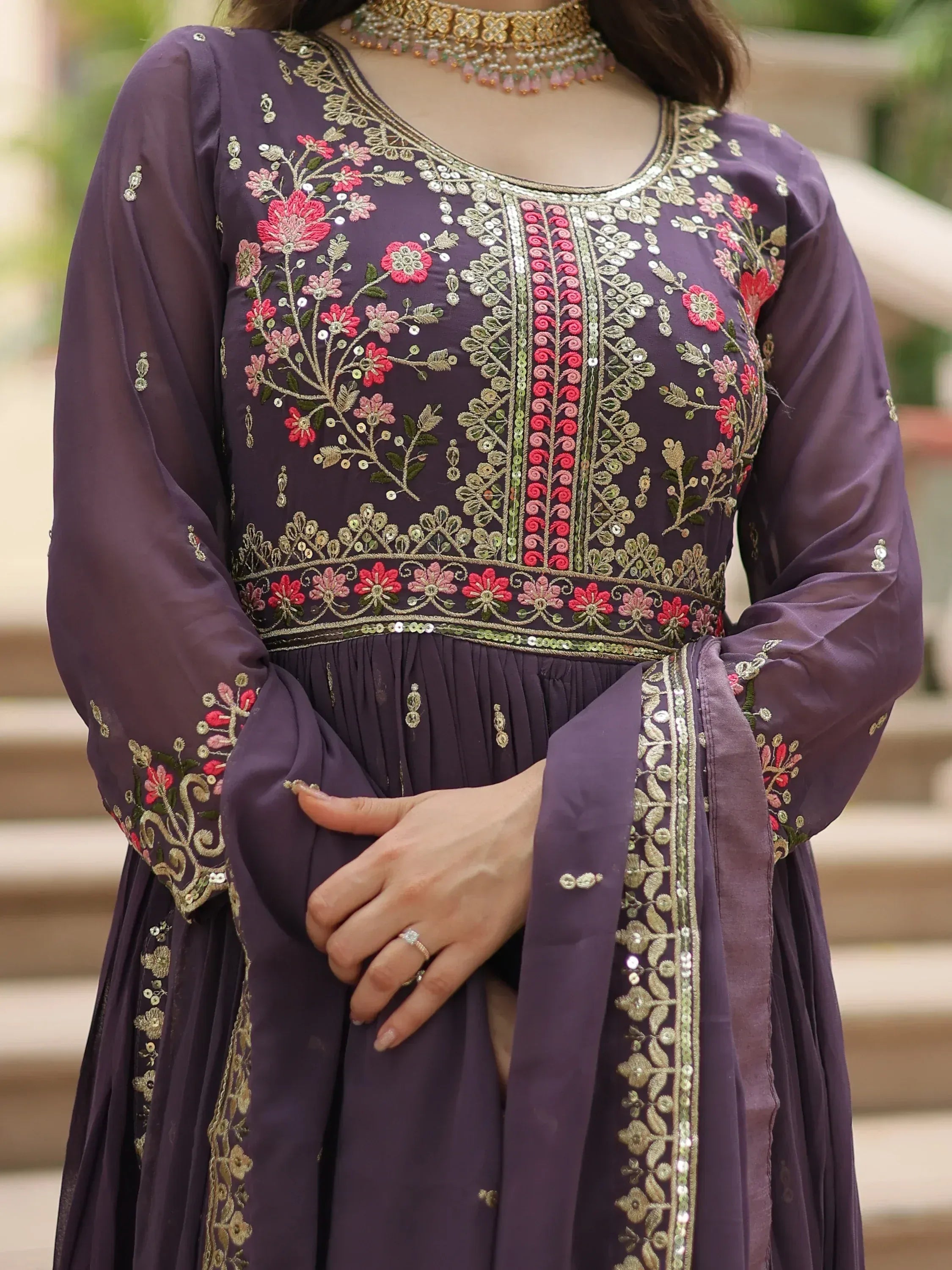 Purple embroidered Indian ethnic gown with gold and pink floral detailing