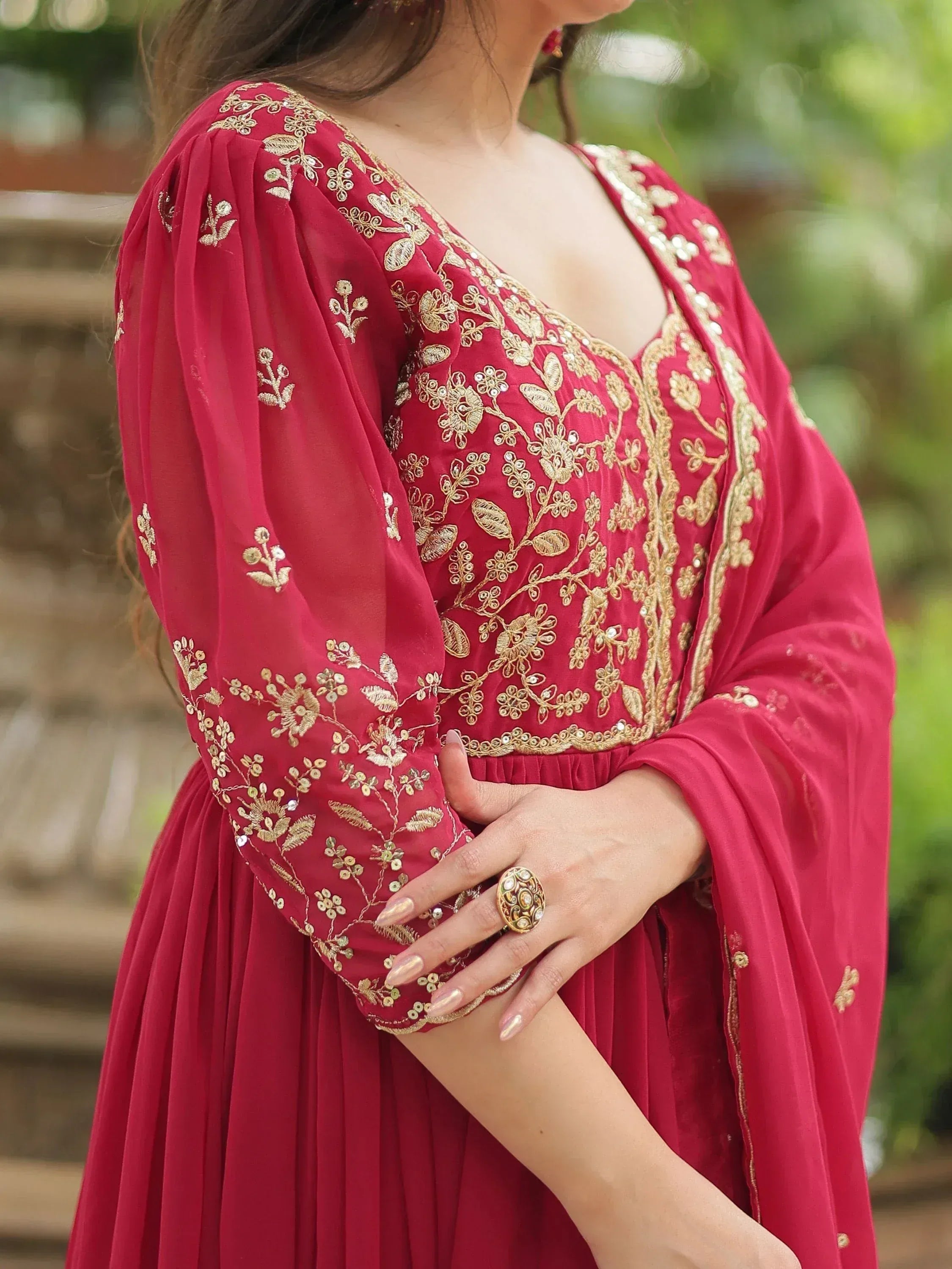 Red ethnic gown with gold floral embroidery and sheer sleeves
