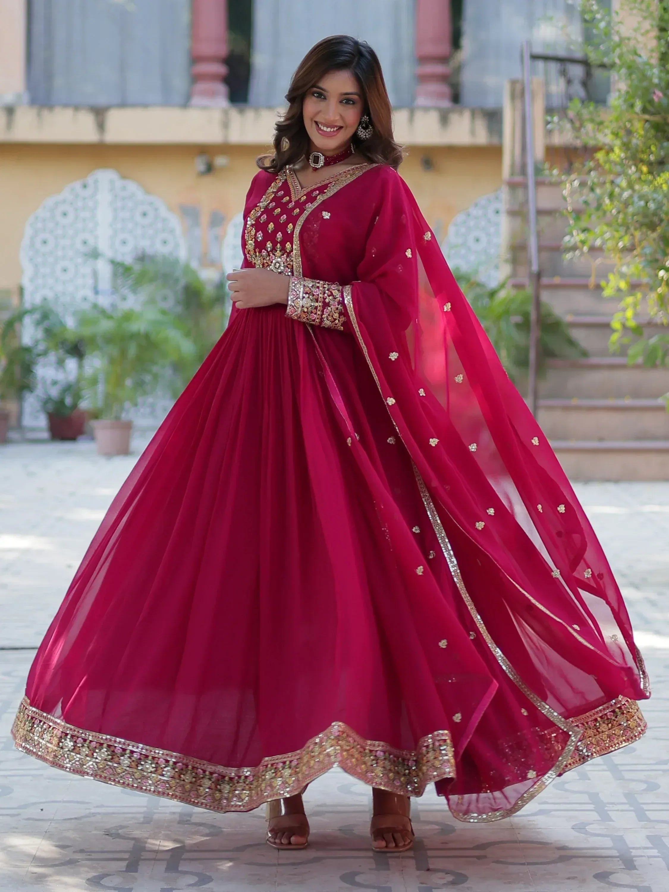 Elegant maroon anarkali with gold embroidery, perfect for Indian ethnic occasions and weddings.