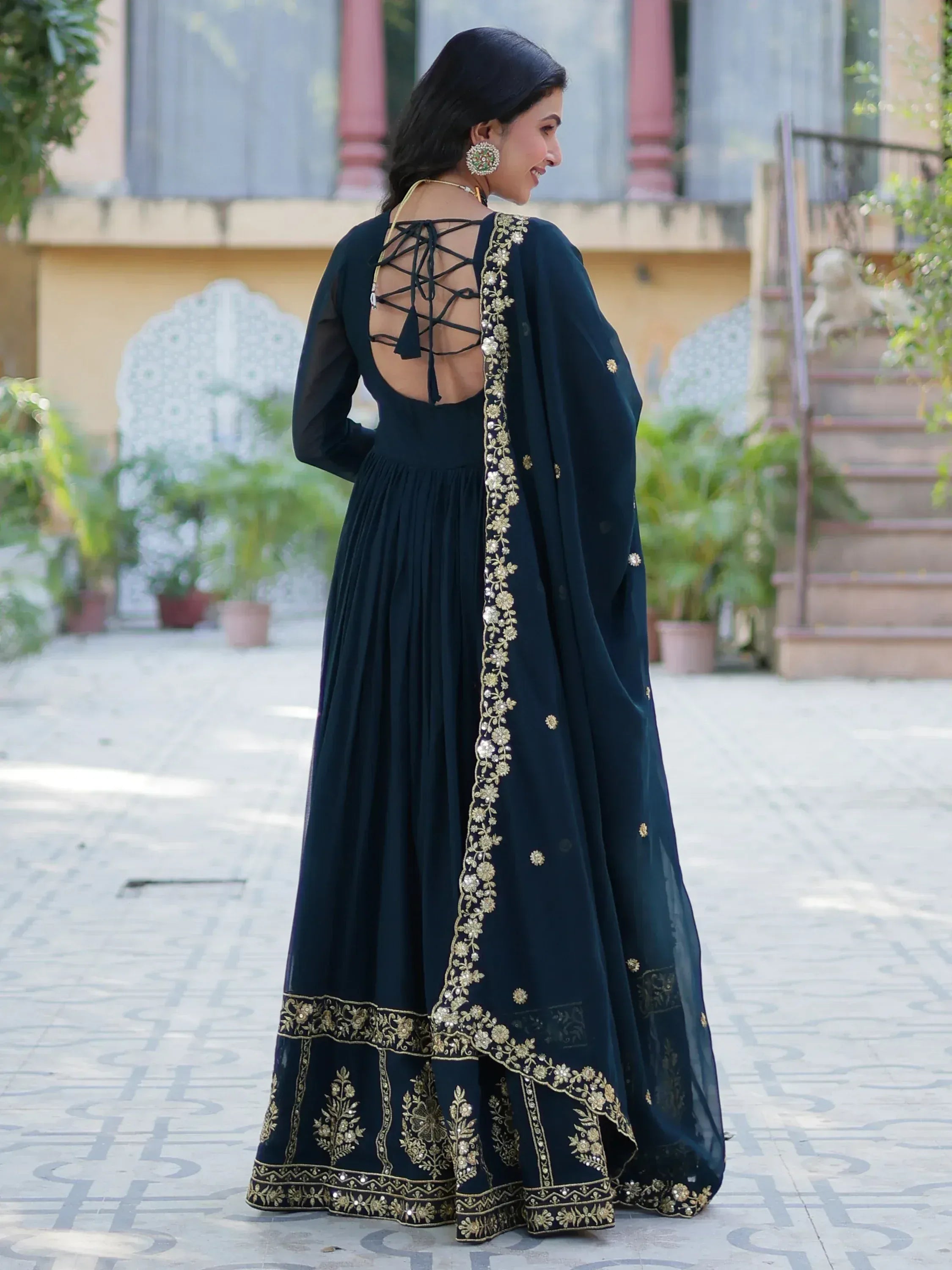 Elegant navy blue anarkali with gold embroidery, lace-up back, and sheer dupatta for Indian ethnic wear