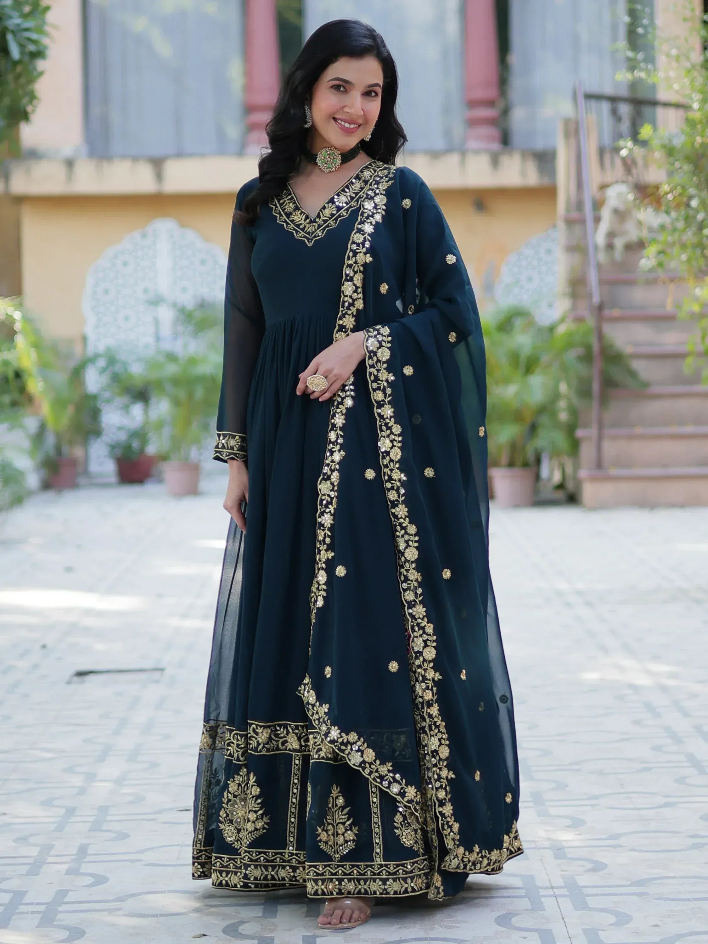 Elegant navy blue anarkali with gold floral embroidery, perfect for Indian ethnic wear occasions.