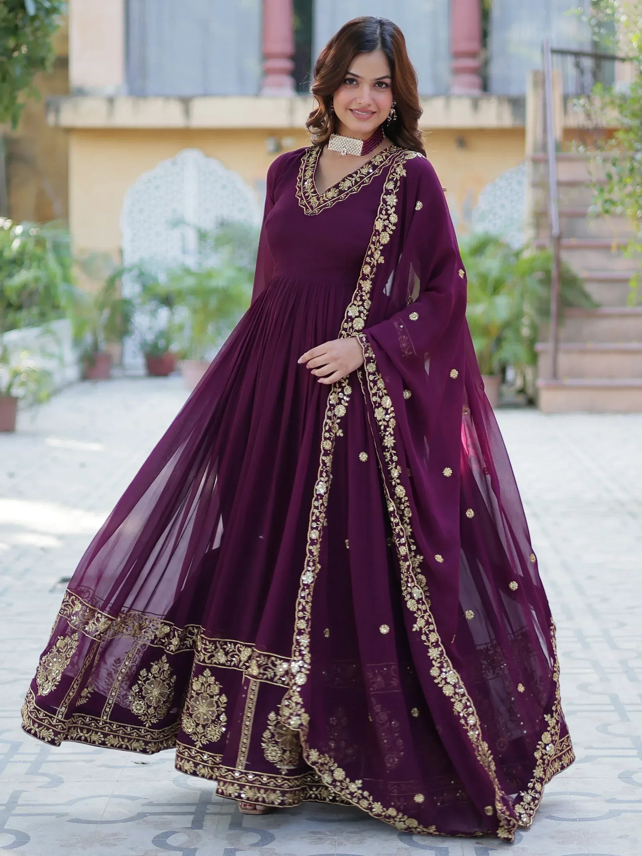 Elegant maroon anarkali with gold embroidery, perfect for Indian ethnic wear and festive occasions.