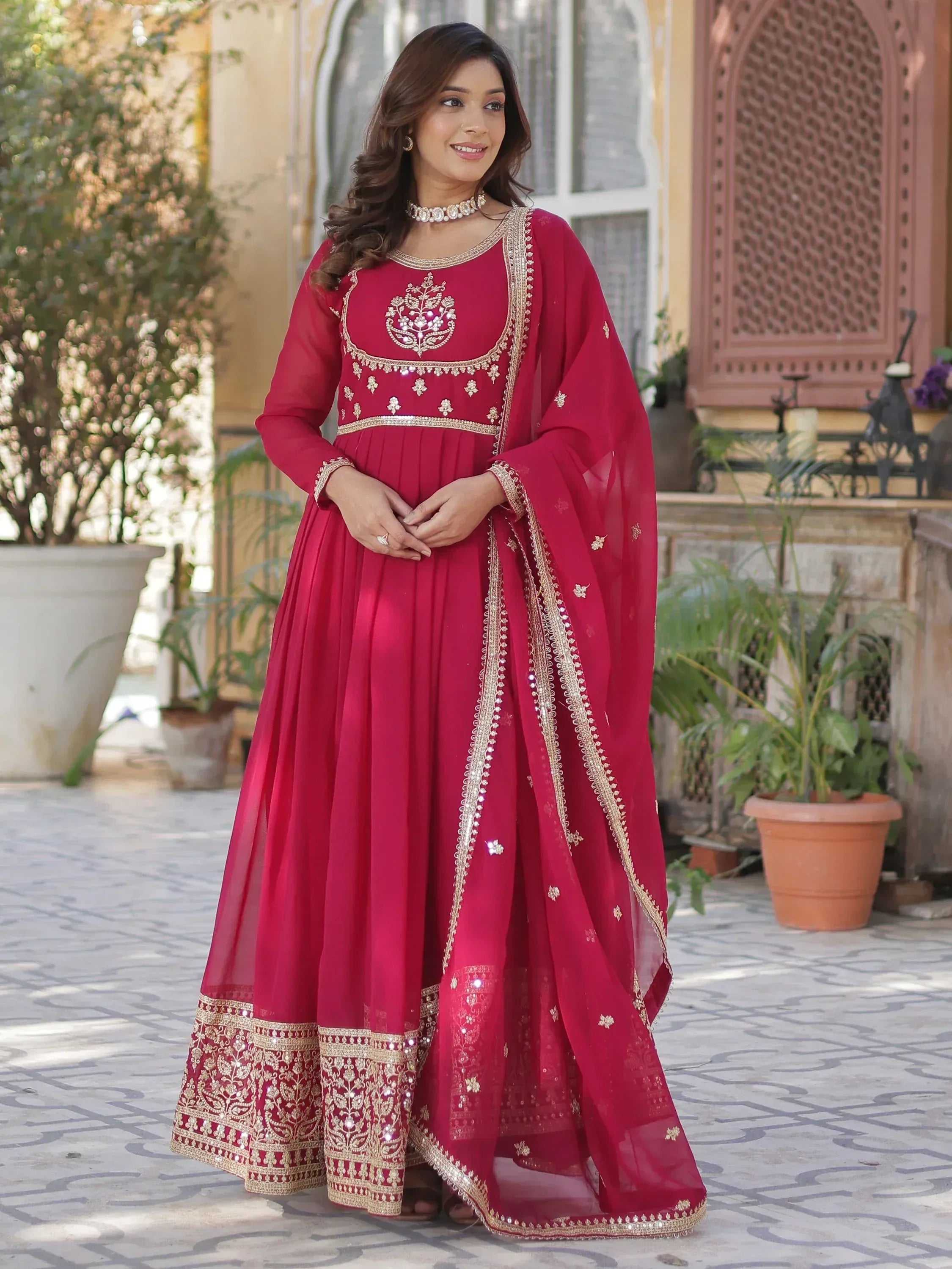 Red ethnic anarkali suit with gold embroidery and dupatta, perfect for Indian weddings and festivals