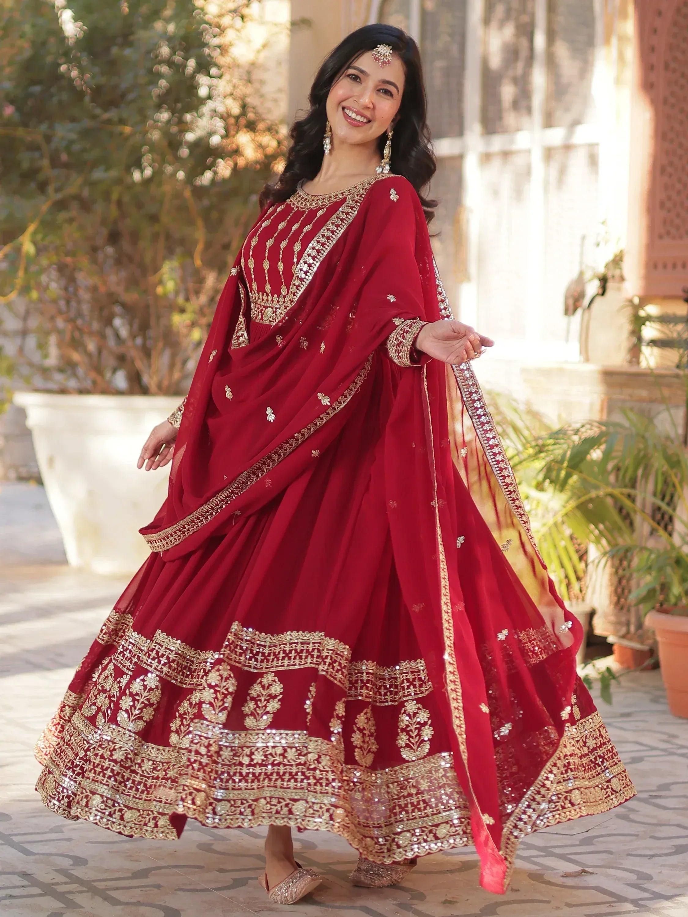 Red embroidered lehenga choli with gold detailing, perfect for Indian ethnic wear and festive occasions.