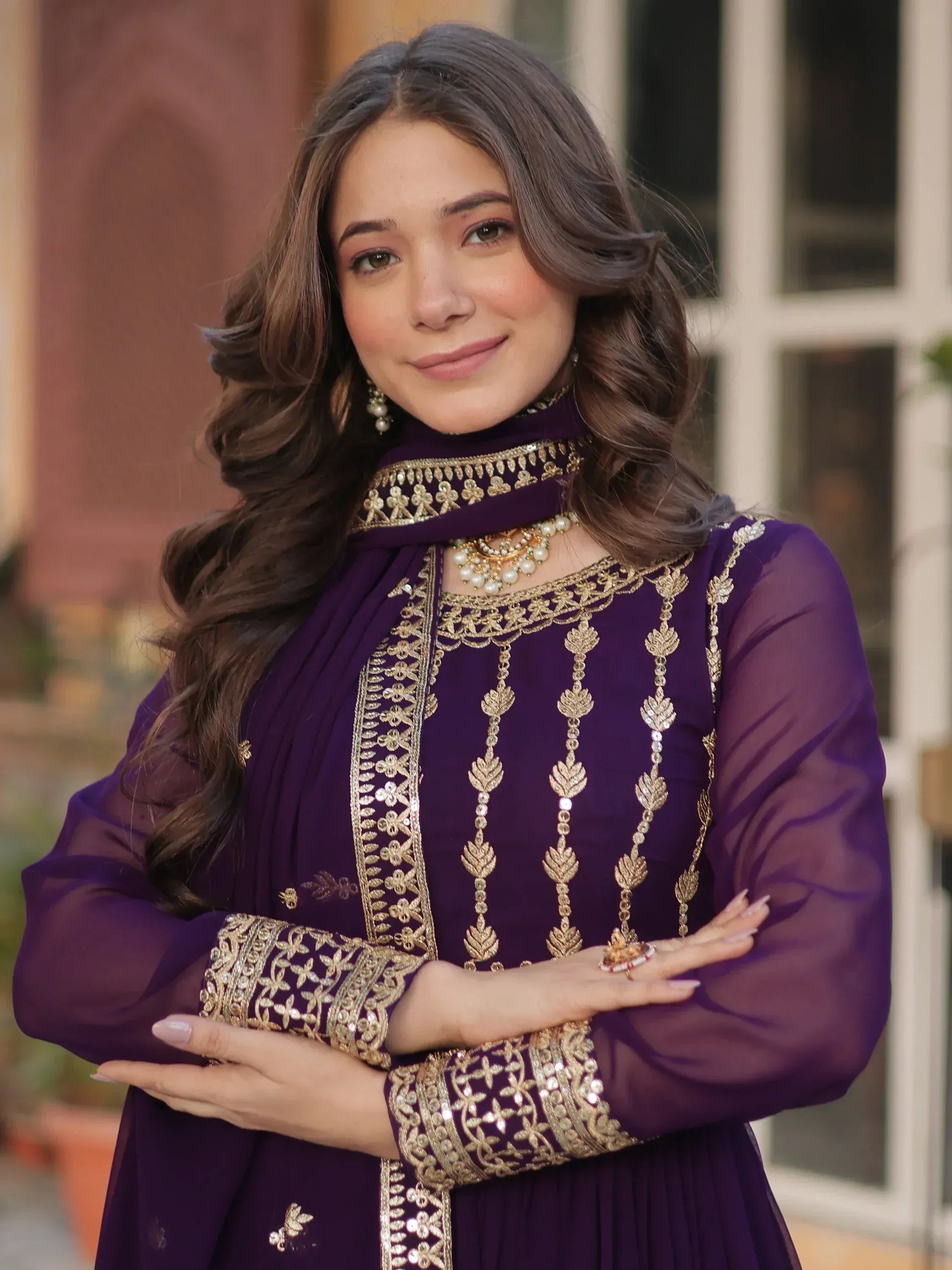 Purple ethnic gown with gold embroidery, perfect for Indian occasions and festive wear.