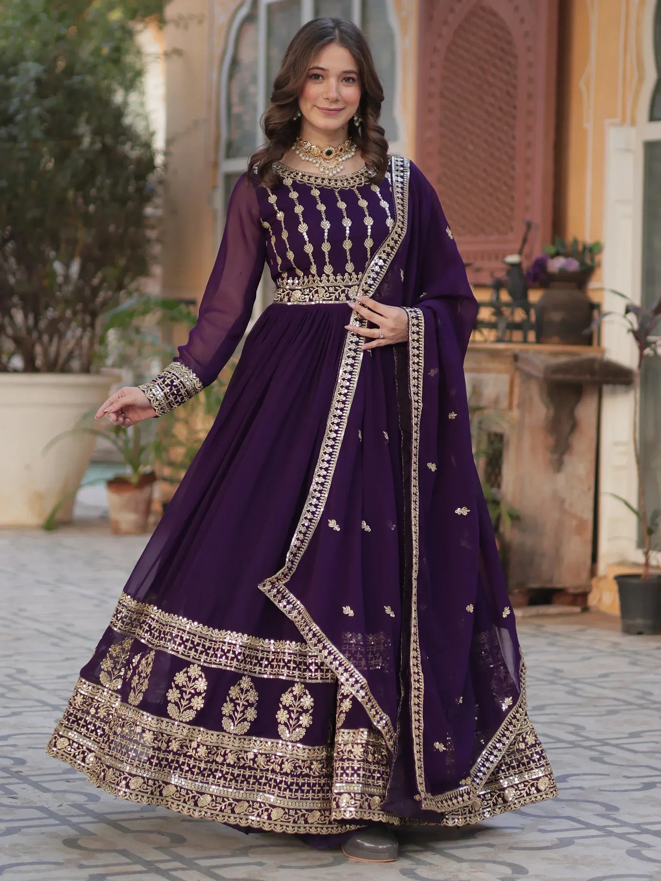 Elegant purple anarkali suit with gold embroidery, perfect for Indian ethnic wear and festive occasions.