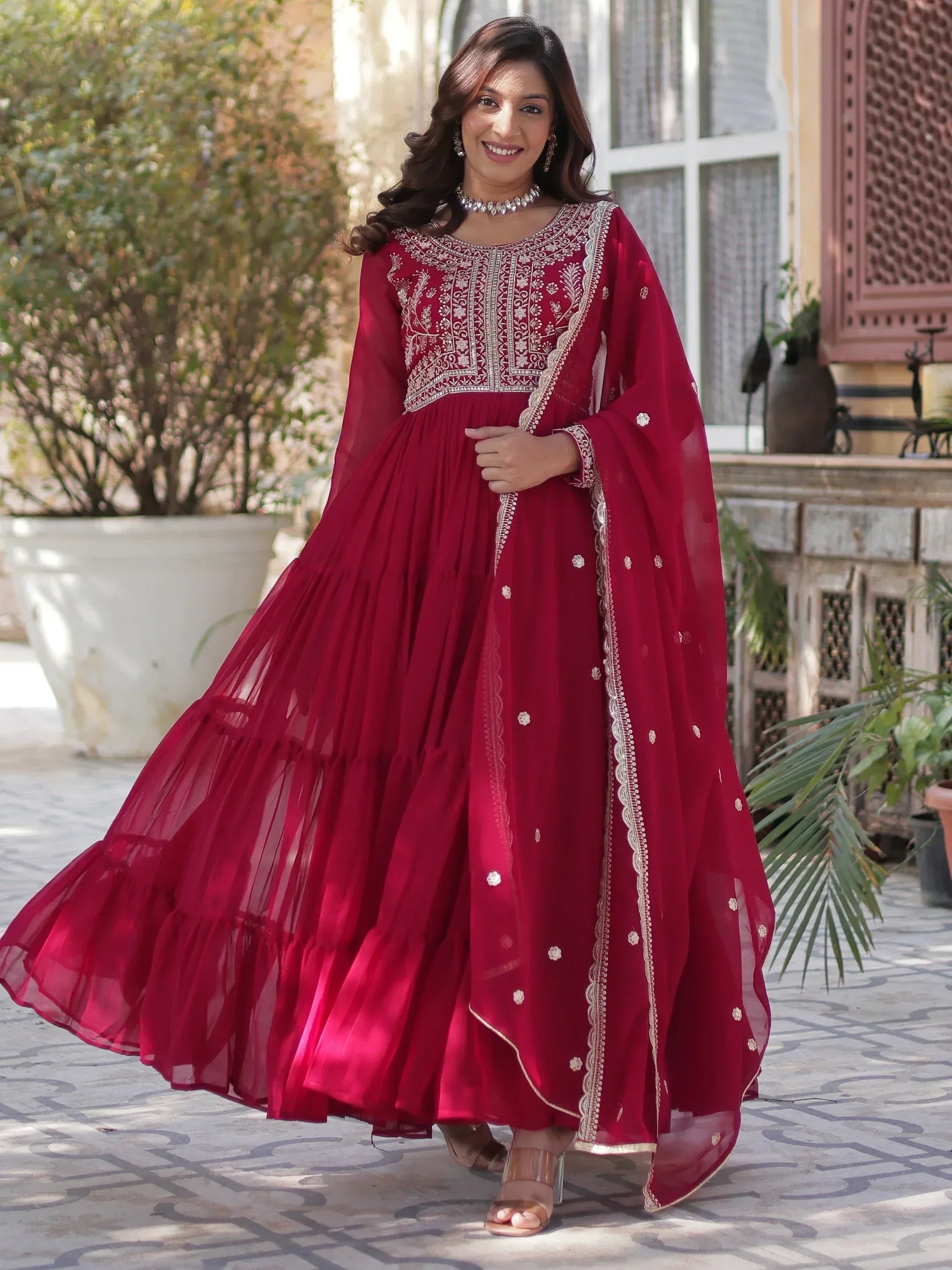Elegant maroon anarkali suit with silver embroidery and flared skirt, perfect for Indian ethnic occasions