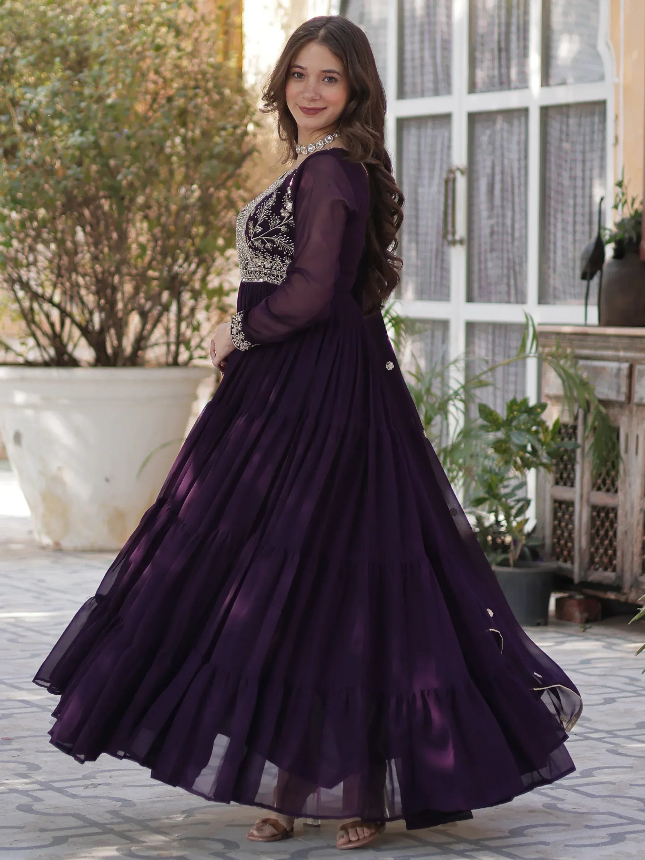 Elegant purple ethnic gown with silver embroidery, perfect for Indian festive occasions and weddings.
